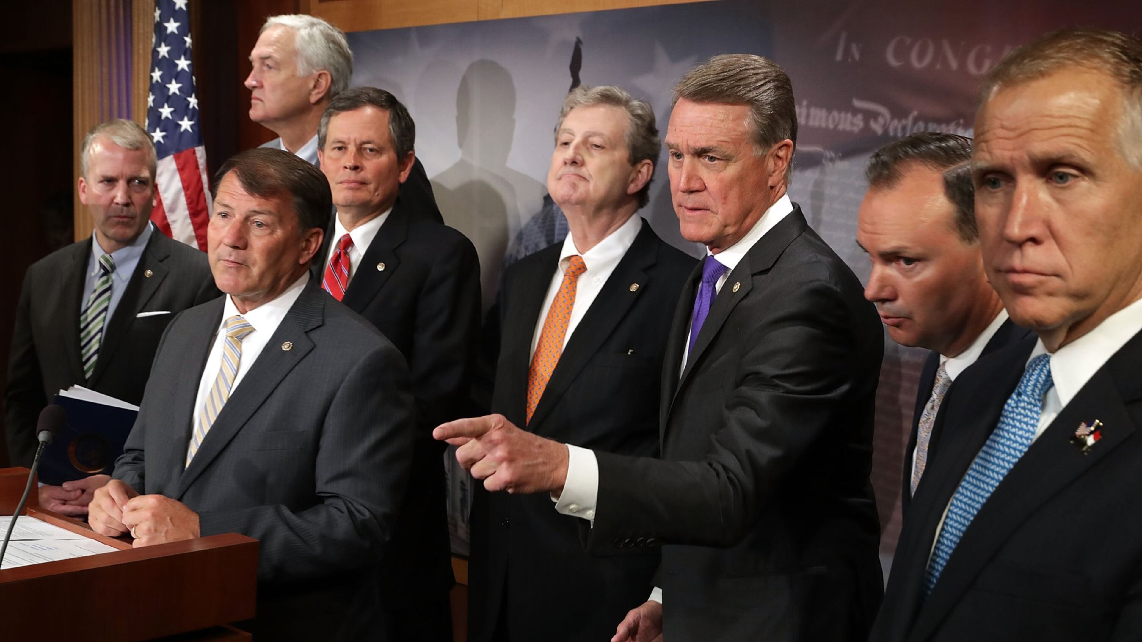 Republican U.S. Sens. Dan Sullivan of Arkansas, from left, Mike Rounds of South Dakota, Luther Strange of Alabama, Steve Daines of Montana, John Kennedy of Louisiana, David Perdue of Georgia, Mike Lee of Utah and Thom Tillis of North Carolina hold a news conference Tuesday at the U.S. Capitol to call on Senate Republican leadership to cancel the upcoming August recess. Shortly afterward, U.S. Senate Majority Leader Mitch McConnell of Kentucky agreed to shorten the recess to clear the way for action on health care, the annual defense policy bill and confirming a host of Trump administration nominees. (Photo by Chip Somodevilla/Getty Images)