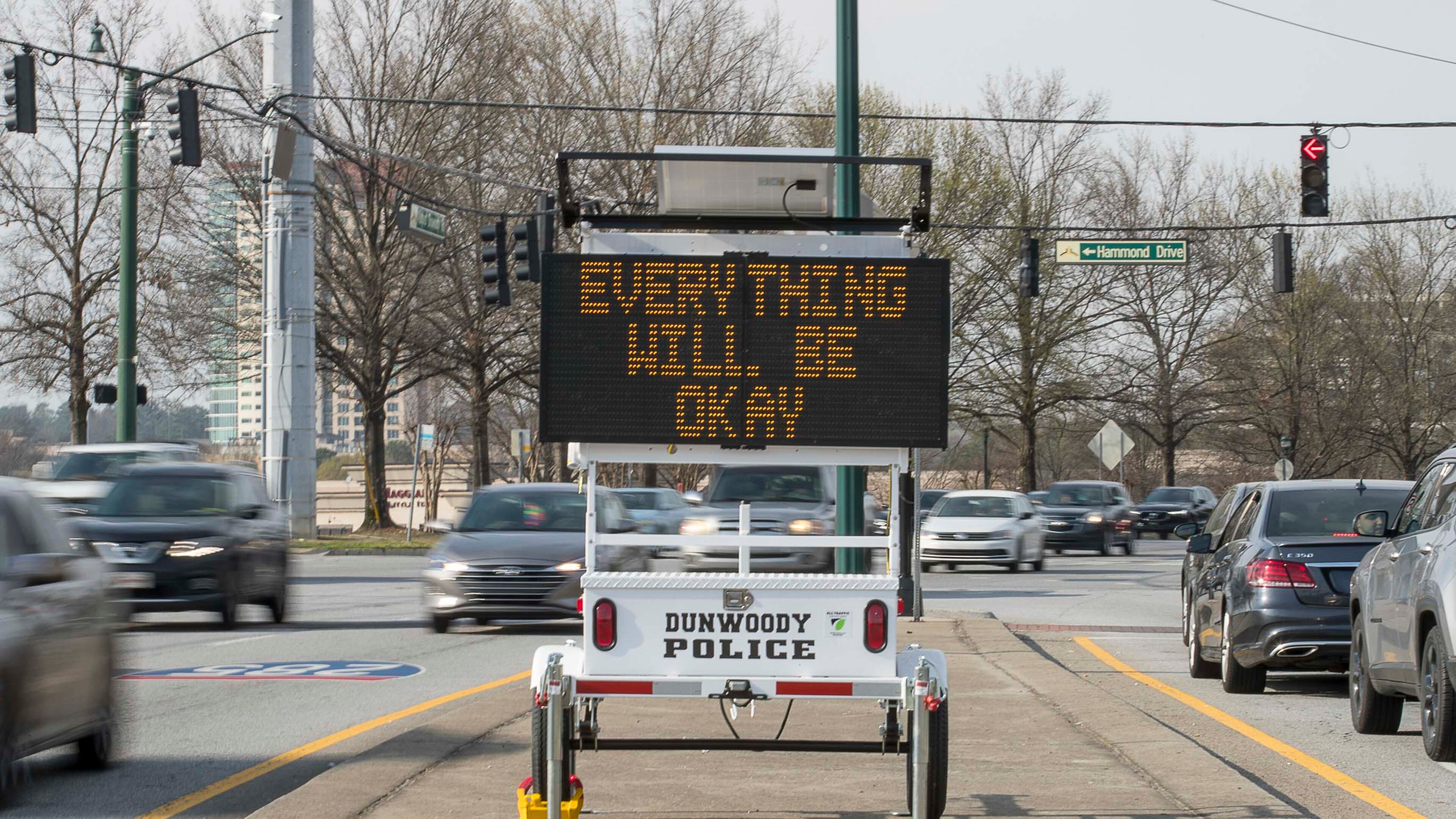 A Dunwoody police electronic sign gives a hopeful message to drivers in March. (ALYSSA POINTER/ALYSSA.POINTER@AJC.COM)