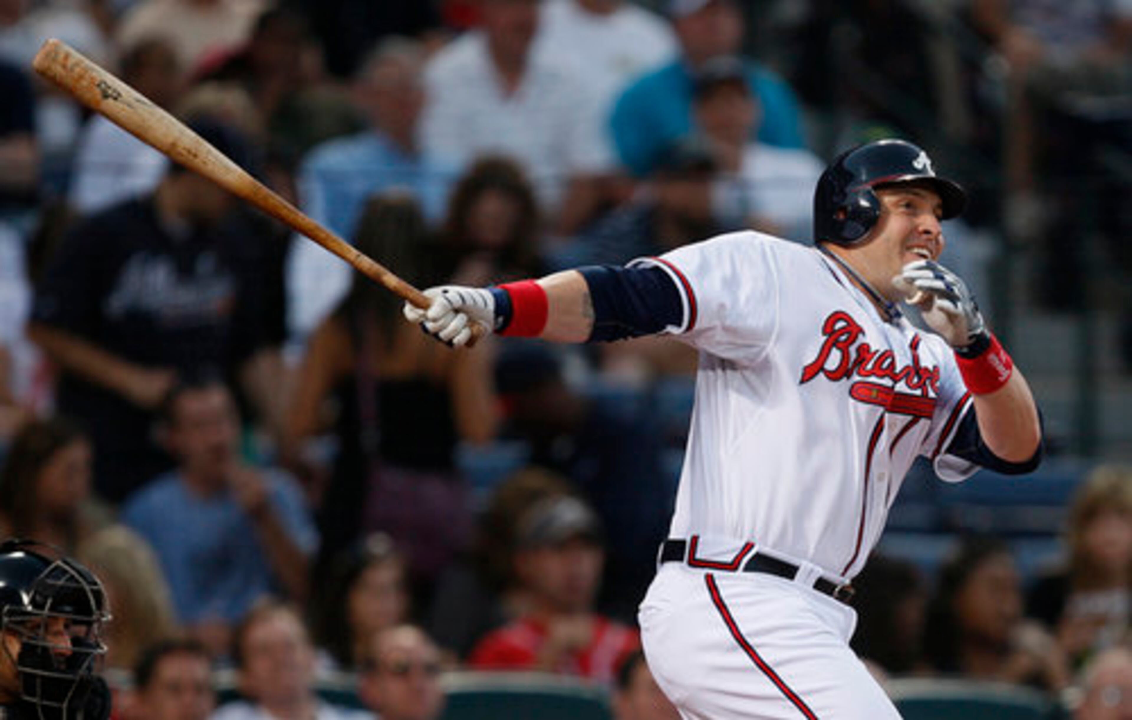 Atlanta Braves' Eric Hinske follows through on a solo home run in the sixth inning of a baseball game against the New York Mets Monday, May 17, 2010 in Atlanta.