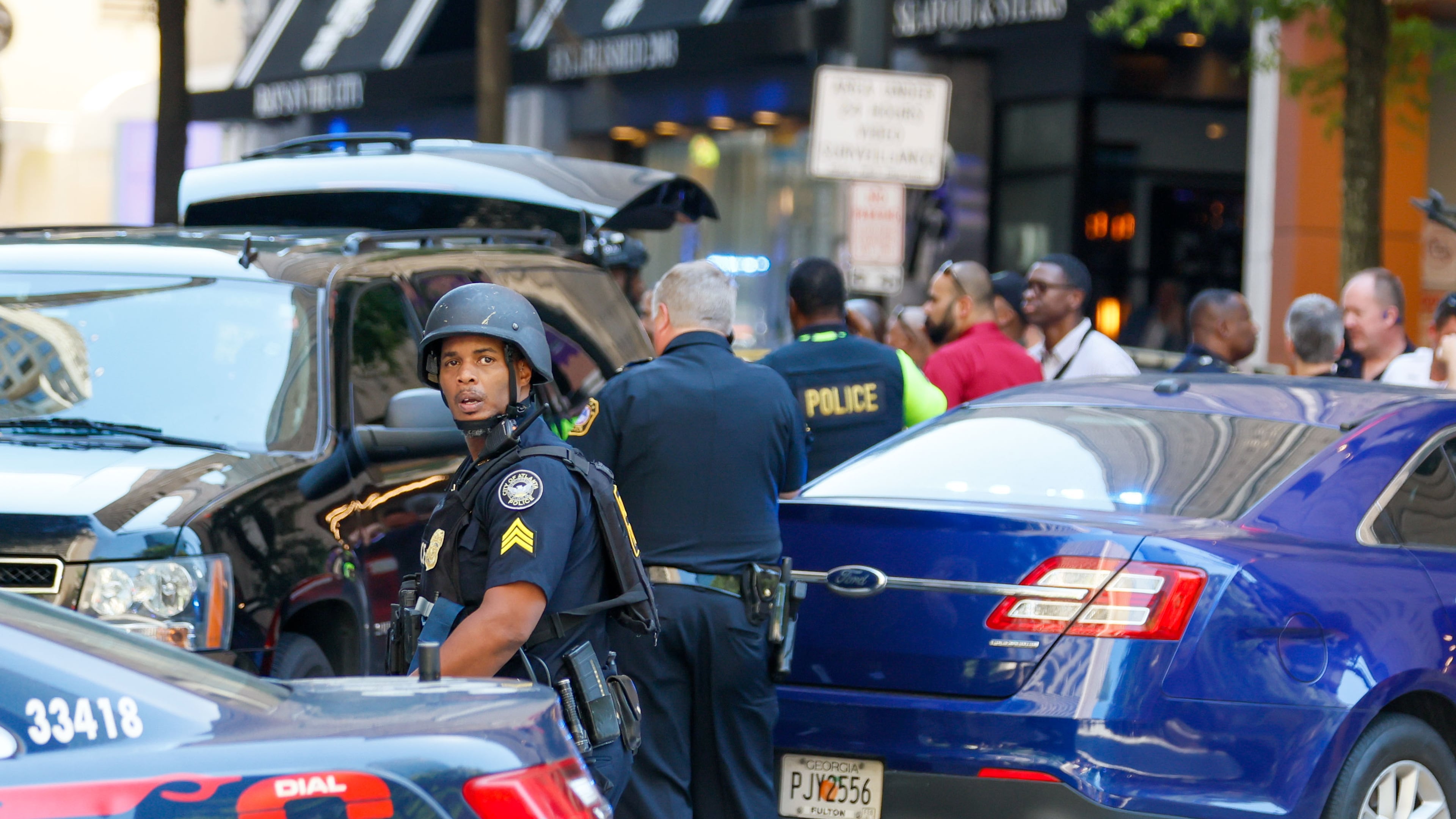 Agents with multiple agencies converge at the scene of a shooting in a busy downtown Atlanta food court at the Peachtree Center on Tuesday, June 11, 2024. One of the witnesses to the shooting later boarded a Ride Gwinnett bus and shot Ernest Byrd Jr., according to a recent lawsuit.
(Miguel Martinez/AJC)