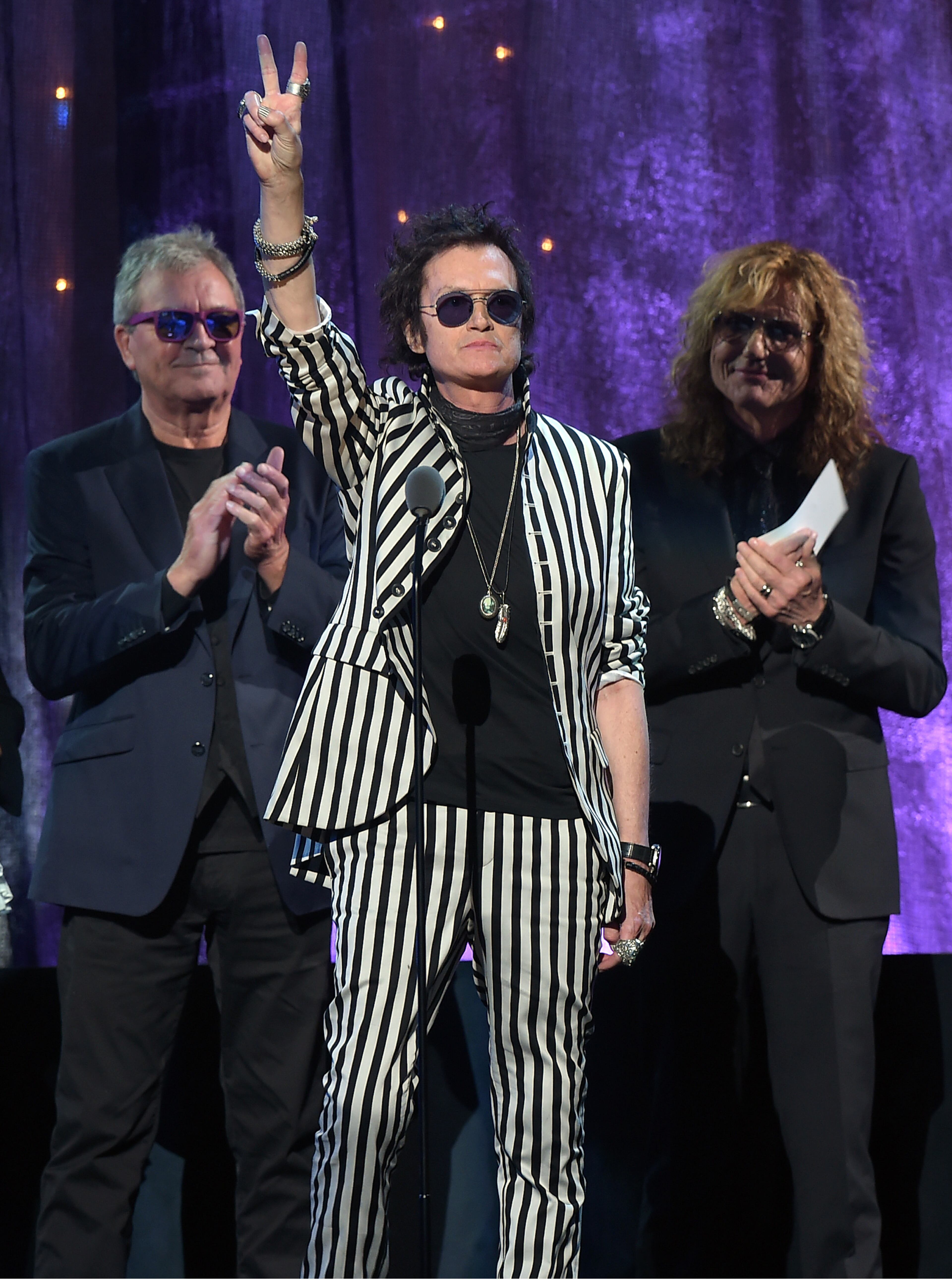 NEW YORK, NEW YORK - APRIL 08: (L-R) Ian Gillian, Glenn Hughes, and David Coverdale of Deep Purple speak on stage at the 31st Annual Rock And Roll Hall Of Fame Induction Ceremony at Barclays Center on April 8, 2016 in New York City. (Photo by Theo Wargo/Getty Images)