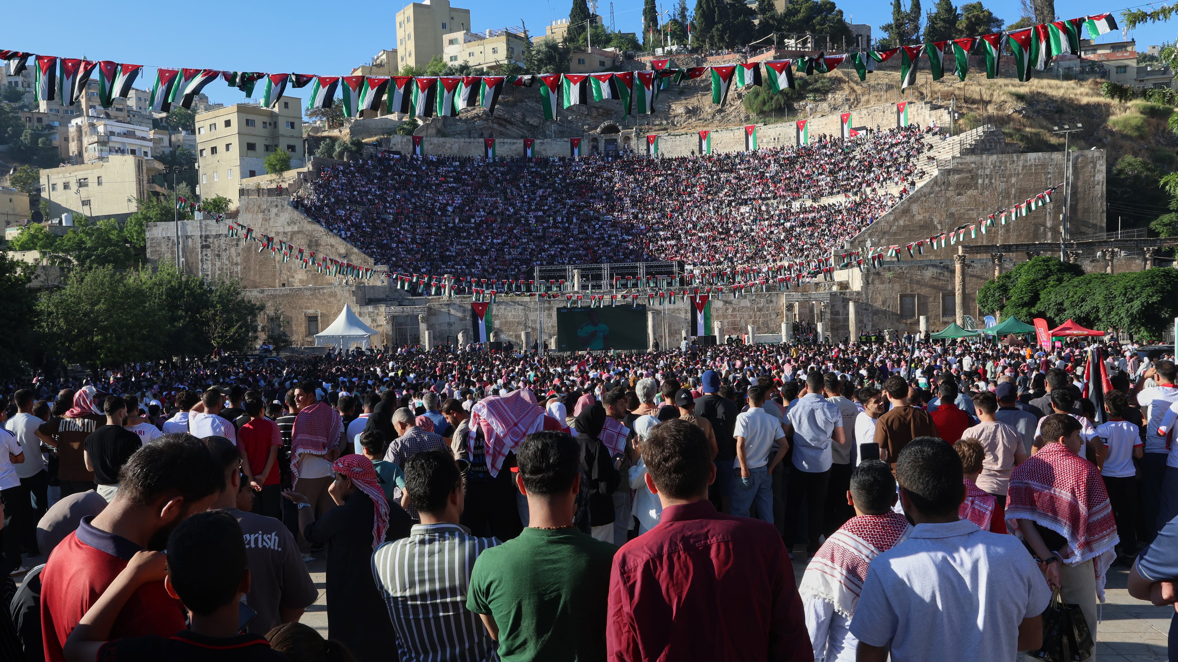 Jordanian soccer fans watch the World Cup match between Jordan and Austria on a large screen at the Roman Amphitheater in downtown Amman, Jordan, early Wednesday, June 17, 2026. (AP Photo/Raad Adayleh)