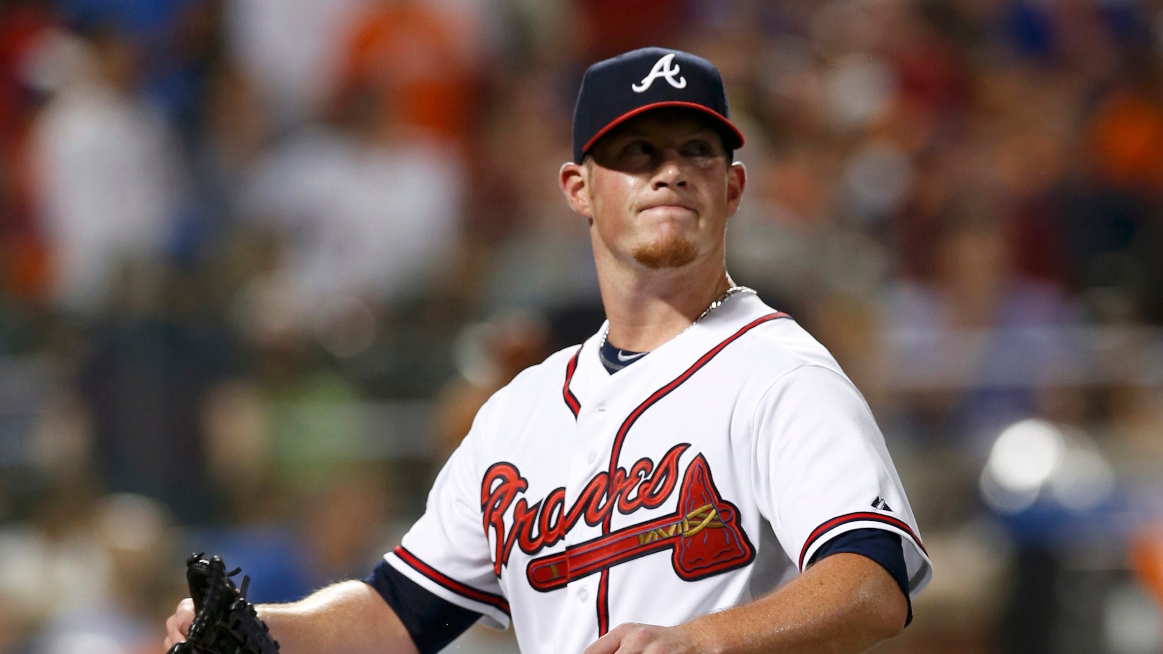 National League pitcher Craig Kimbrel, of the Atlanta Braves, walks back to the dugout after giving up a run in the eighth inning to the American League during Major League Baseball's All-Star Game in New York, July 16, 2013. REUTERS/Mike Segar (UNITED STATES - Tags: SPORT BASEBALL)