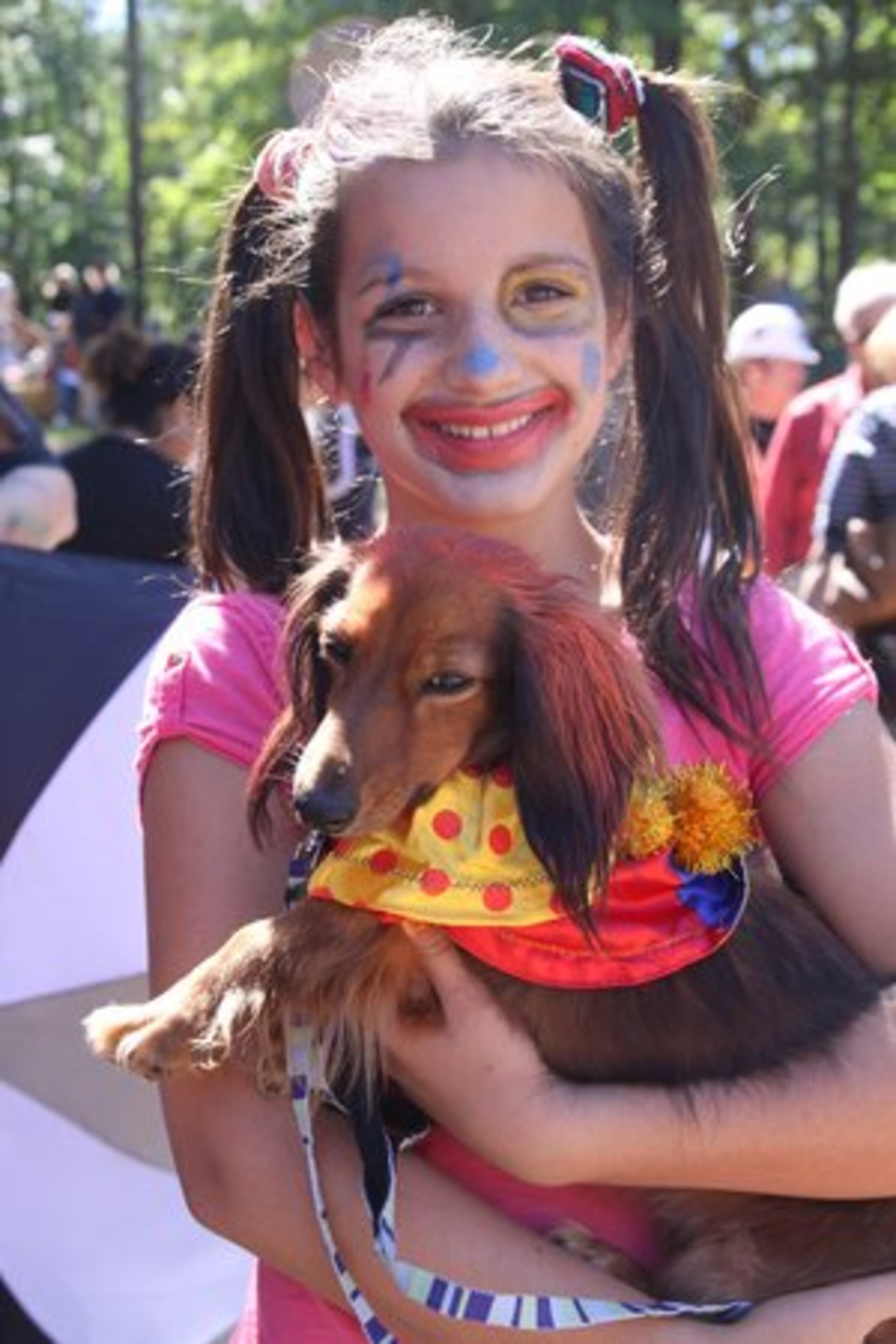 Skylar Dennis, 11, poses with her dog Penny.