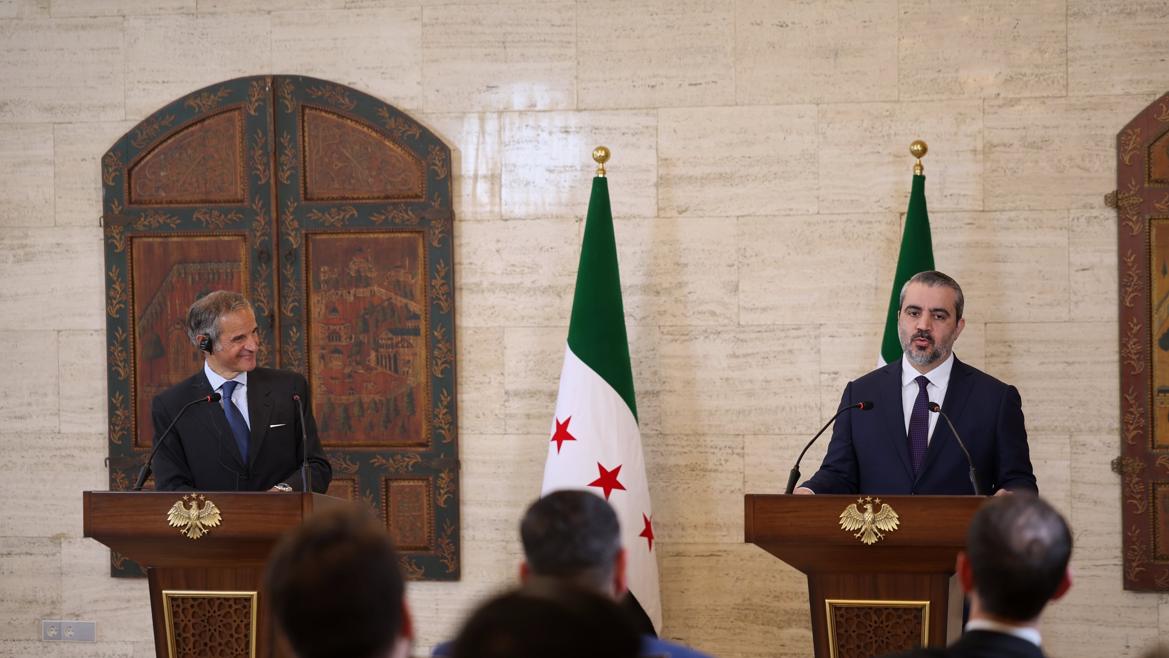 International Atomic Energy Agency's director-general Rafael Mariano Grossi, left, and Syrian Foreign Minister Asaad al-Shibani attend a press conference in Damascus, Syria, Tuesday Aug. 18, 2026. (AP Photo/Ghaith Alsayed)