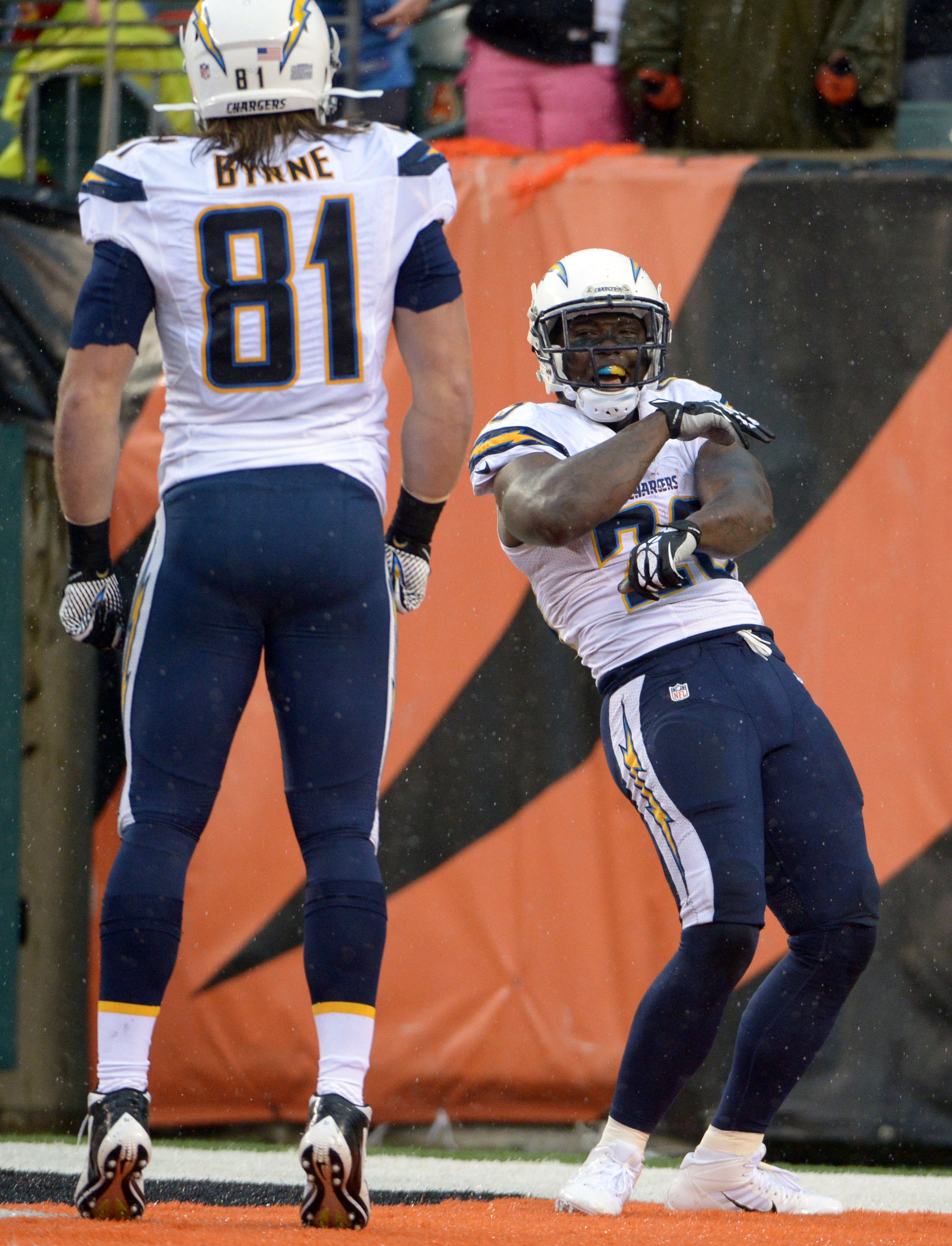 San Diego Chargers running back Ronnie Brown (23) celebrates with tight end Jake Byrne (81) after scoring on a 58-yard touchdown run in the fourth quarter in the 2013 AFC wild card playoff football game against the Cincinnati Bengals at Paul Brown Stadium. The Chargers defeated the Bengals 27-10.