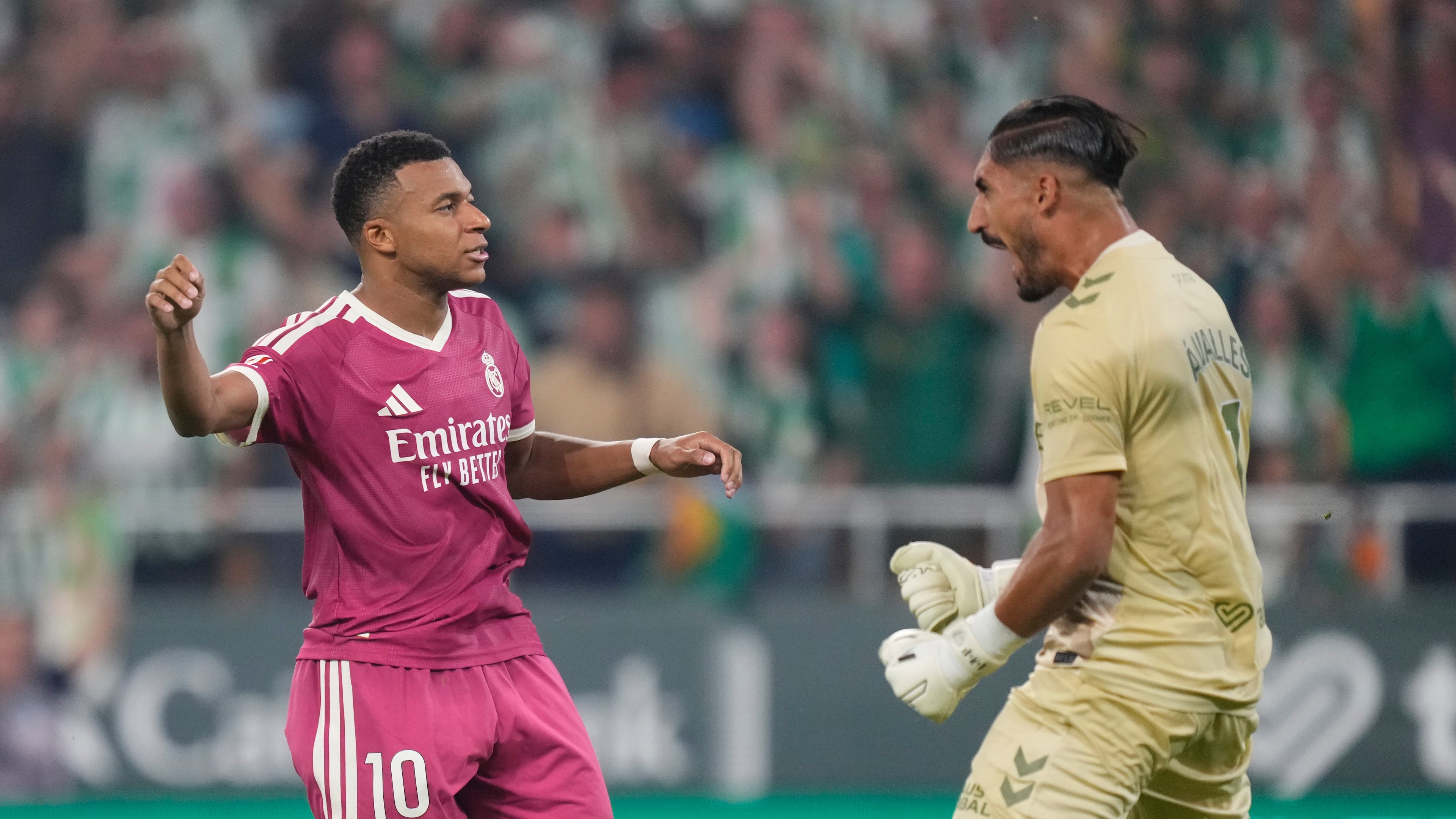 Real Madrid's Kylian Mbappe, left, reacts after missing a penalty kick in front of Betis' goalkeeper Alvaro Valles during the Spanish La Liga soccer match between Real Betis and Real Madrid in Seville, Spain, Friday, Sept. 4, 2026. (AP Photo/Jose Breton)