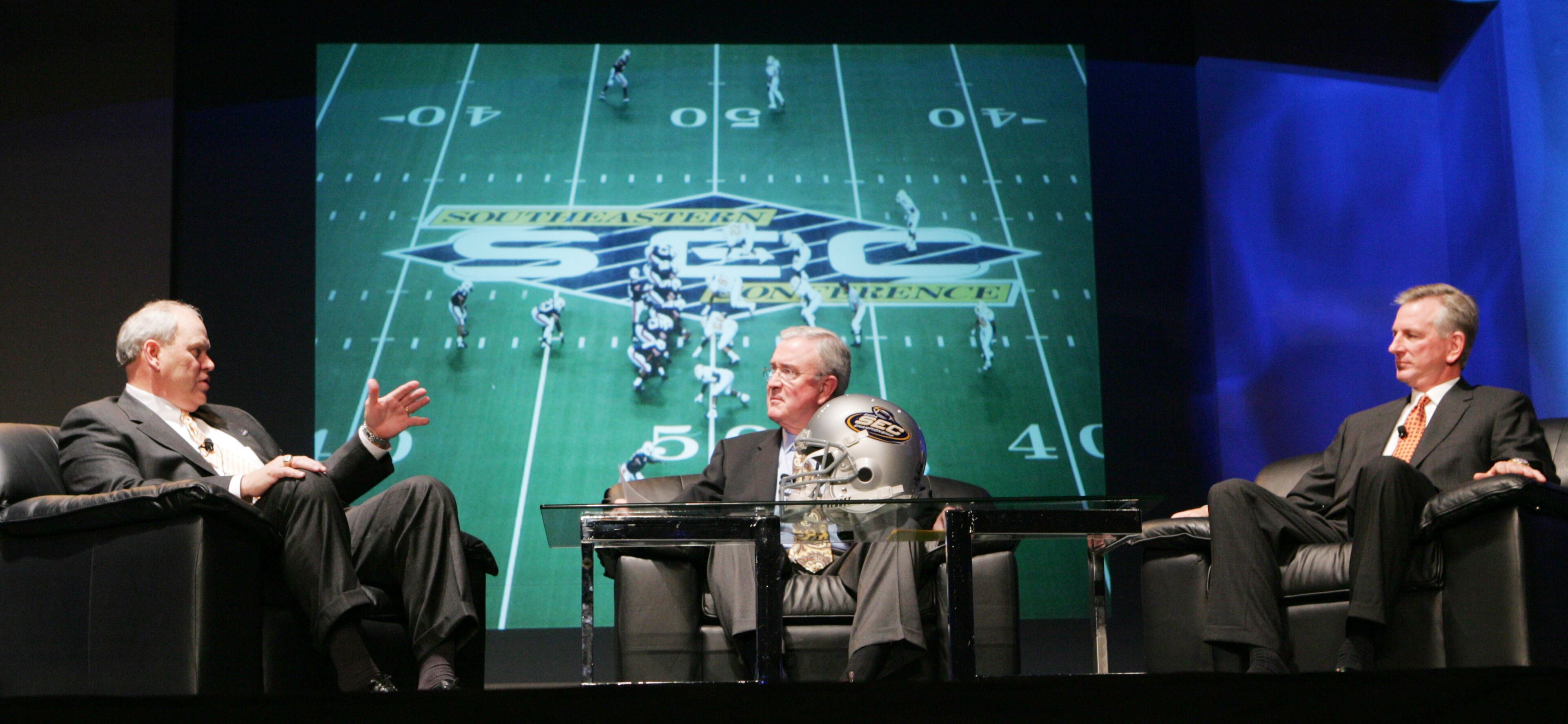 ESPN announcer Ron Franklin, center, was fired after calling sideline reporter Jeannine Edwards "sweet baby" and calling her a name after she objected.