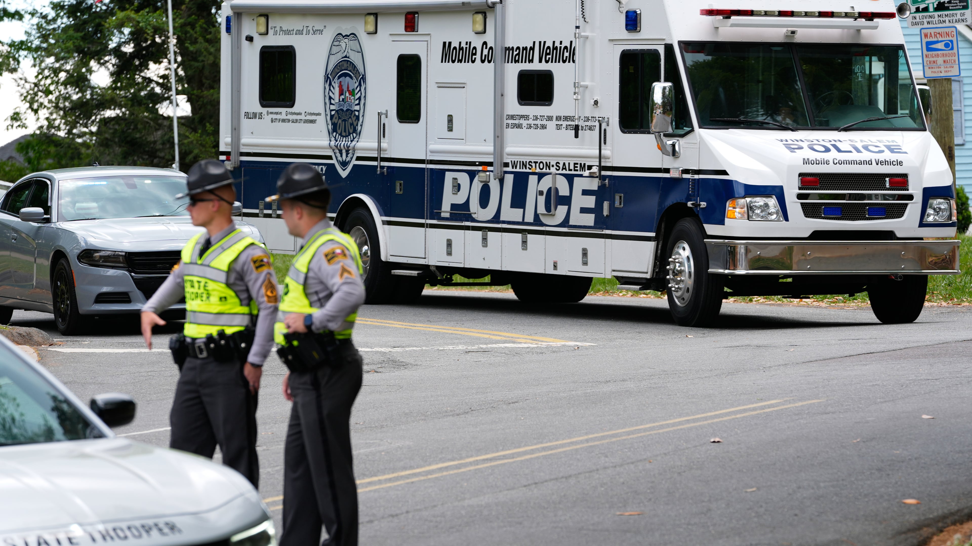 A police mobile command vehicle leaves the the scene of a shooting at Leinbach Park on Monday, April 20, 2026, in Winston-Salem, N.C. (AP Photo/Erik Verduzco)