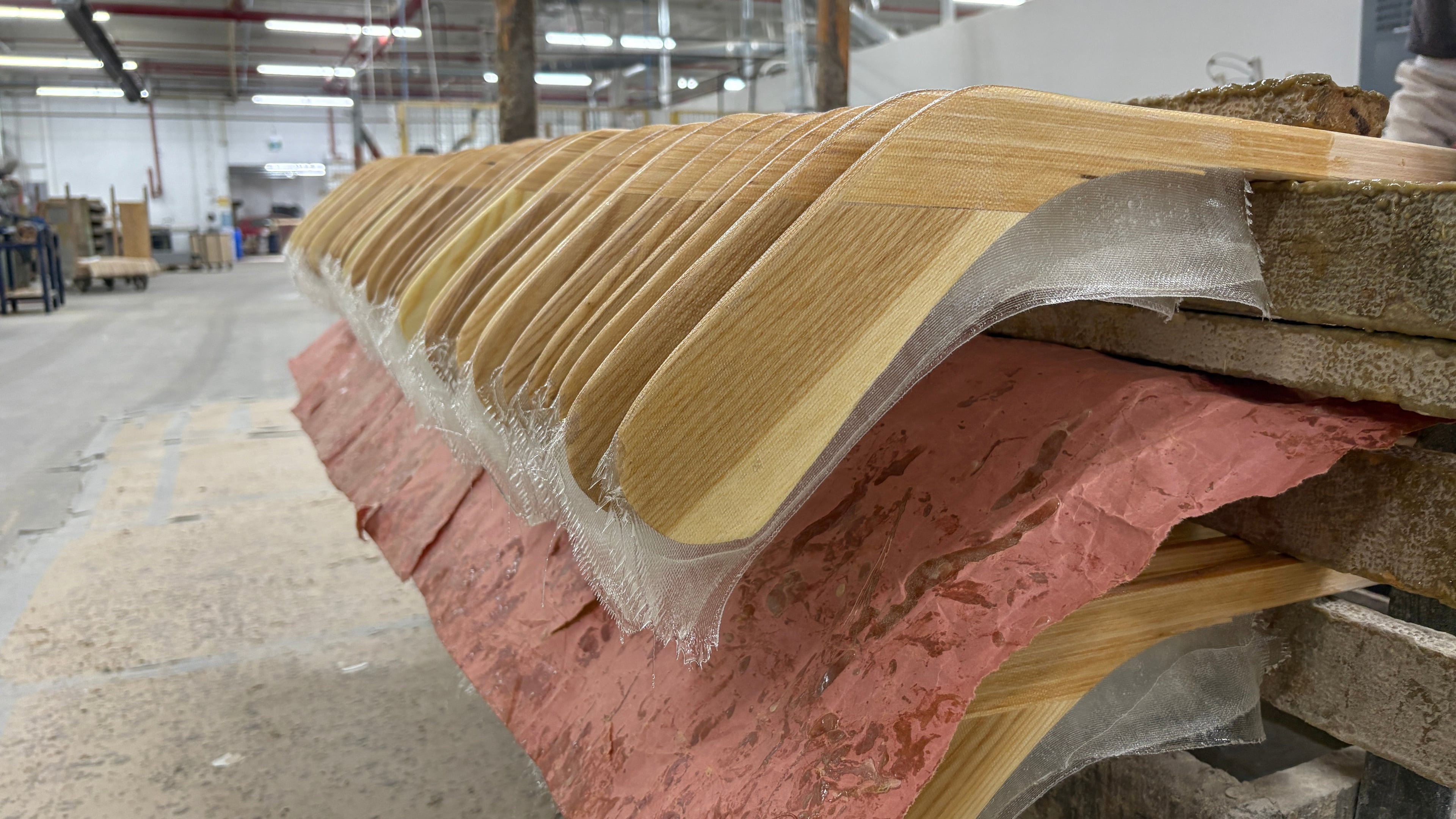 FILE - Wooden hockey sticks are stacked as they move along the assembly line at the Roustan Hockey factory, which is the last major manufacturer of hockey sticks in Canada on Aug. 27, 2025 in Brantford, Ontario. (AP Photo/Kelvin Chan, File)