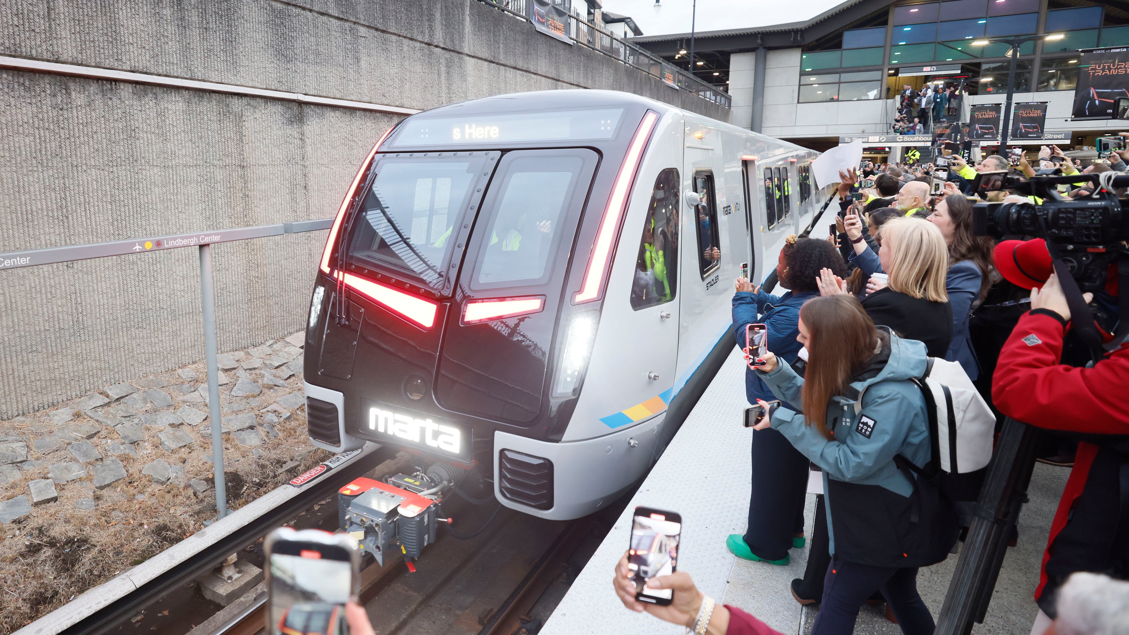 Members of the press and guests record the arrival of the new MARTA train at Lindbergh station during the unveiling of the new MARTA trains on Thursday, January 30, 2025.
(Miguel Martinez/ AJC)