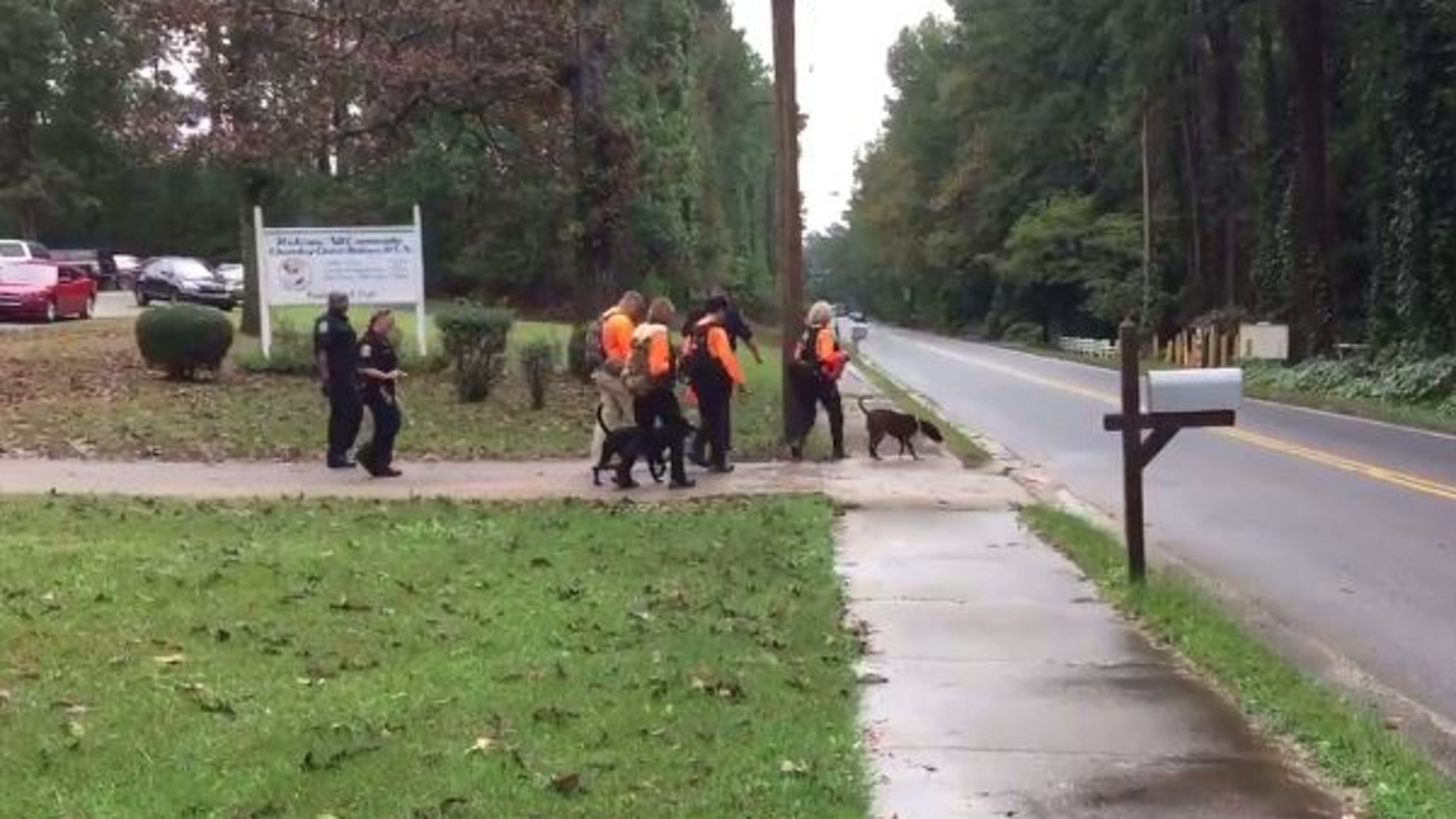 Cadaver dogs and Fulton County police officers were searching an area along Welcome All Road on Saturday. (Credit: Channel 2 Action News)