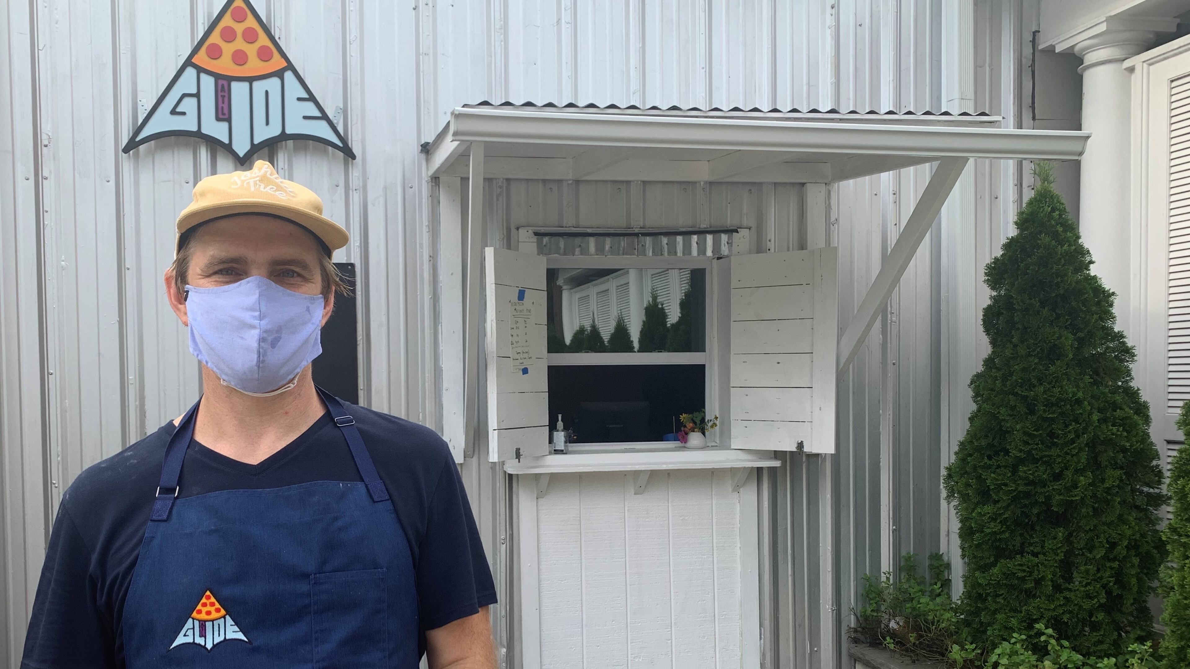 Rob Birdsong in front of his Glide Pizza window on the Eastside Beltline