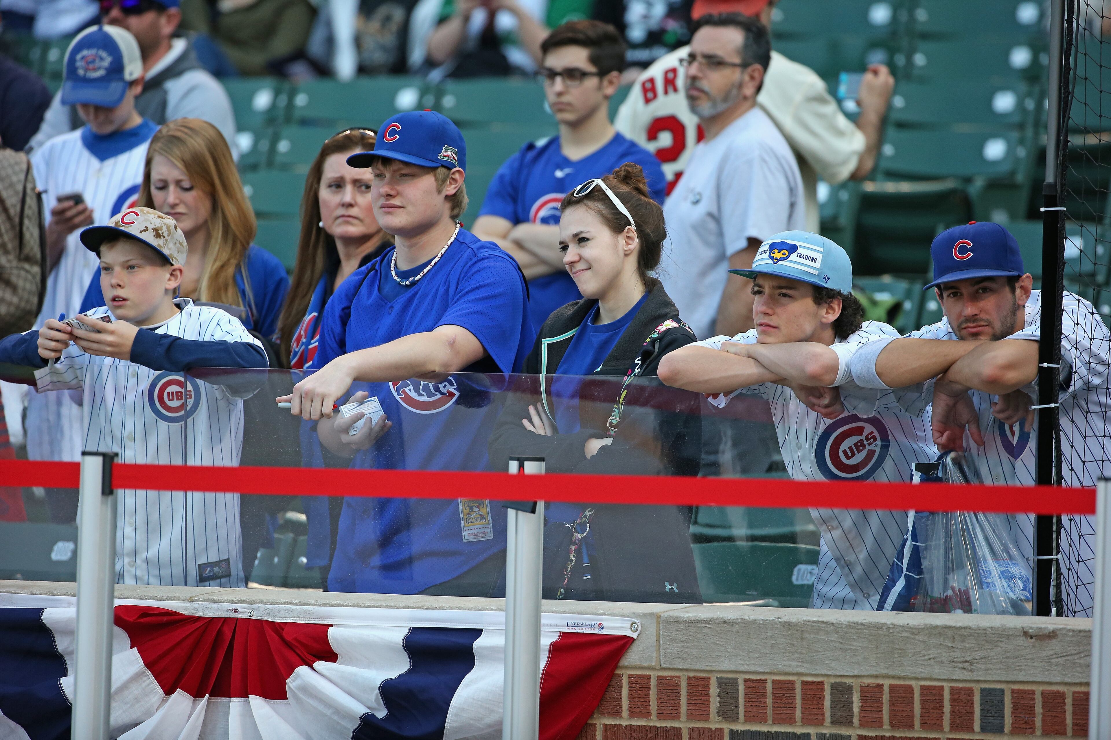 CHICAGO, IL - APRIL 05: Fans watch batting practice before the Opening Night game between the Chicago Cubs and the St. Louis Cardinals at Wrigley Field on April 5, 2015 in Chicago, Illinois. (Photo by Jonathan Daniel/Getty Images)