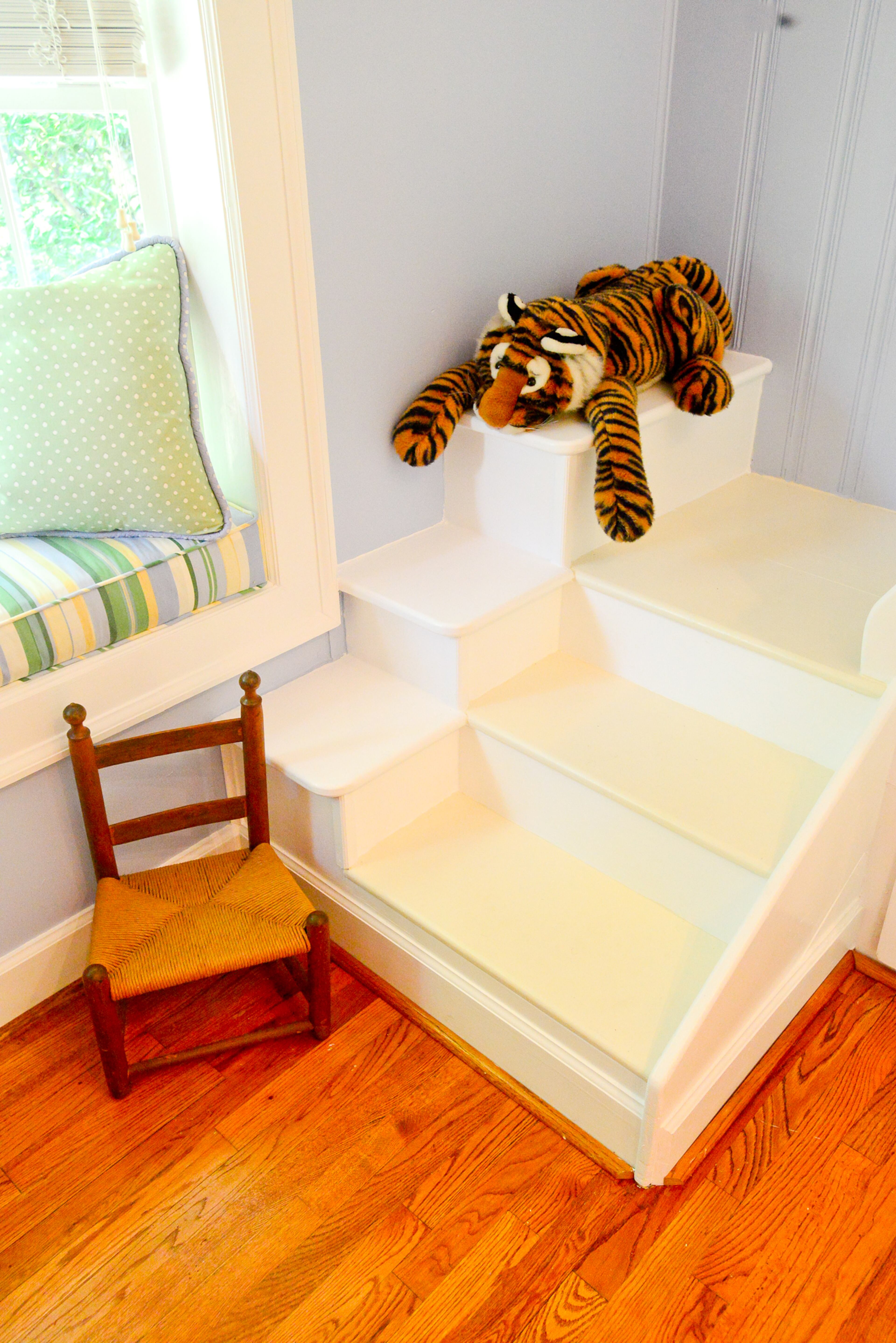 The sturdy steps to a bunk bed were carefully crafted by homeowner Robert Lewis for the room, which also has a bay window seat.