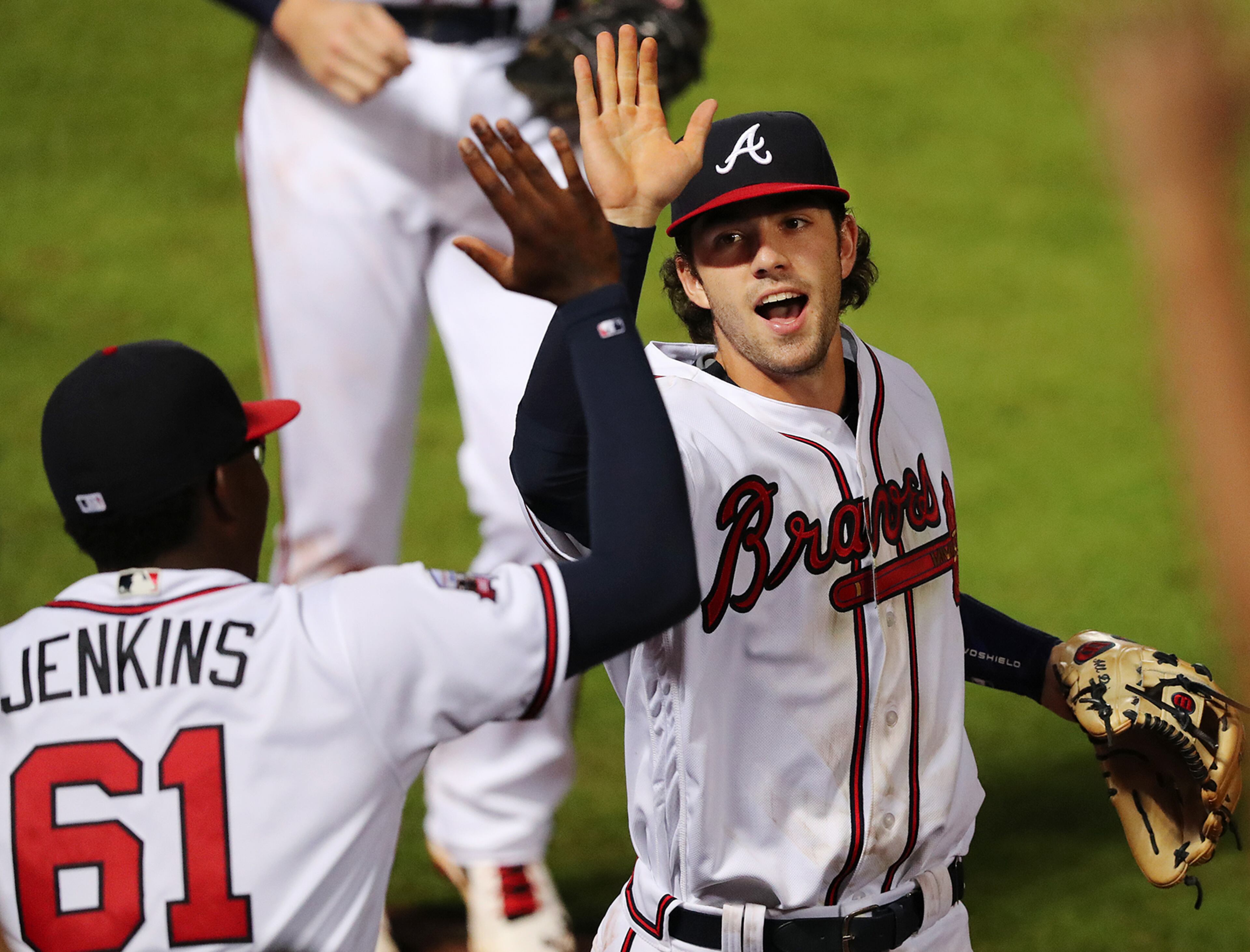 081816 ATLANTA: Braves shortstop Dansby Swanson gets a high five from Tyrell Jenkins after making a play on Nationals Reynaldo Lopez for an out during the seventh inning in a MLB baseball game on Thursday, August 17, 2016, at Turner Field in Atlanta. Curtis Compton /ccompton@ajc.com