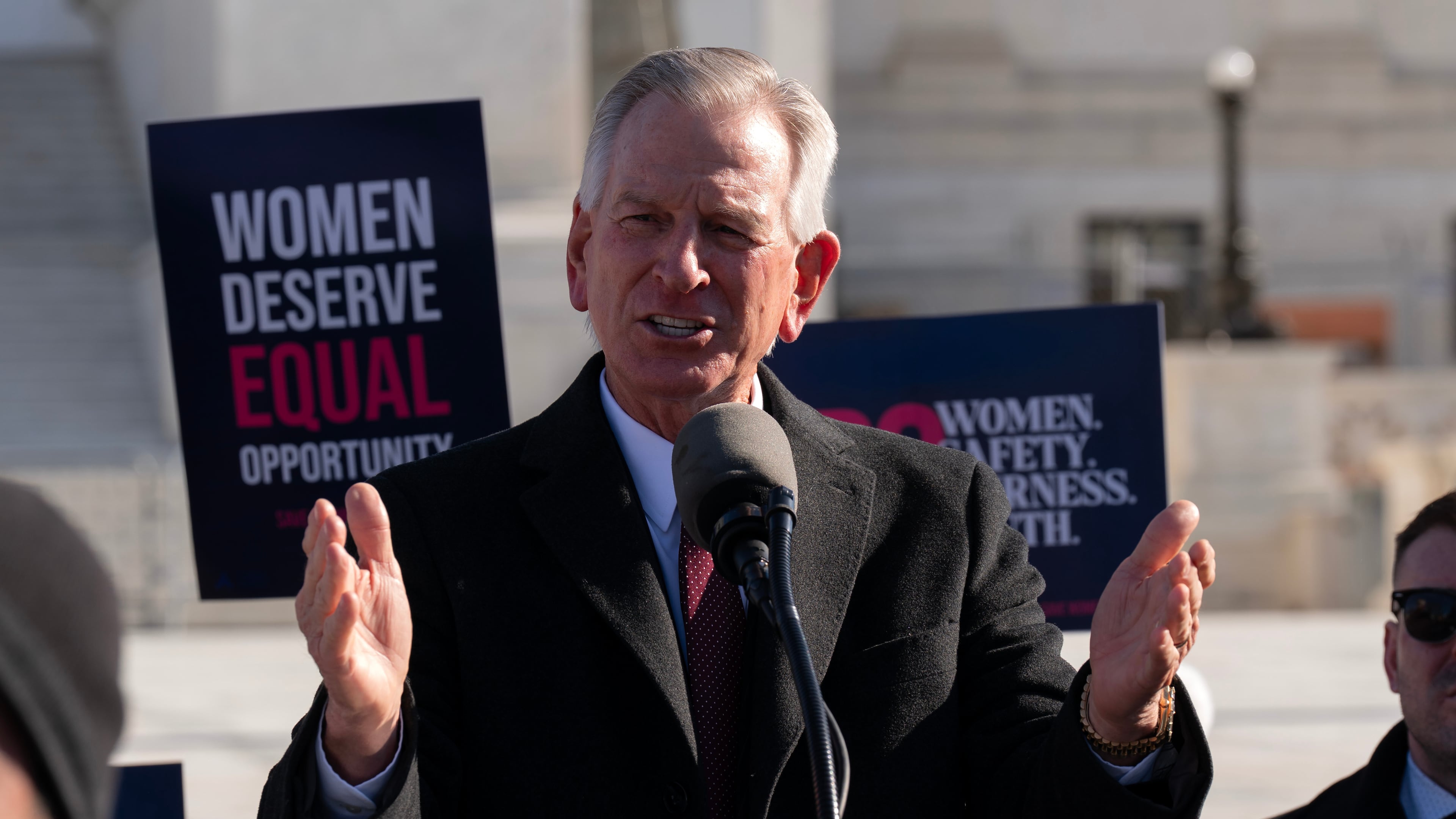 FILE - Sen. Tommy Tuberville, R-Ala., speaks to the crowd as protesters gather outside the Supreme Court as it hears arguments over state laws barring transgender girls and women from playing on school athletic teams, Jan. 13, 2026, in Washington. (AP Photo/Jose Luis Magana, File)