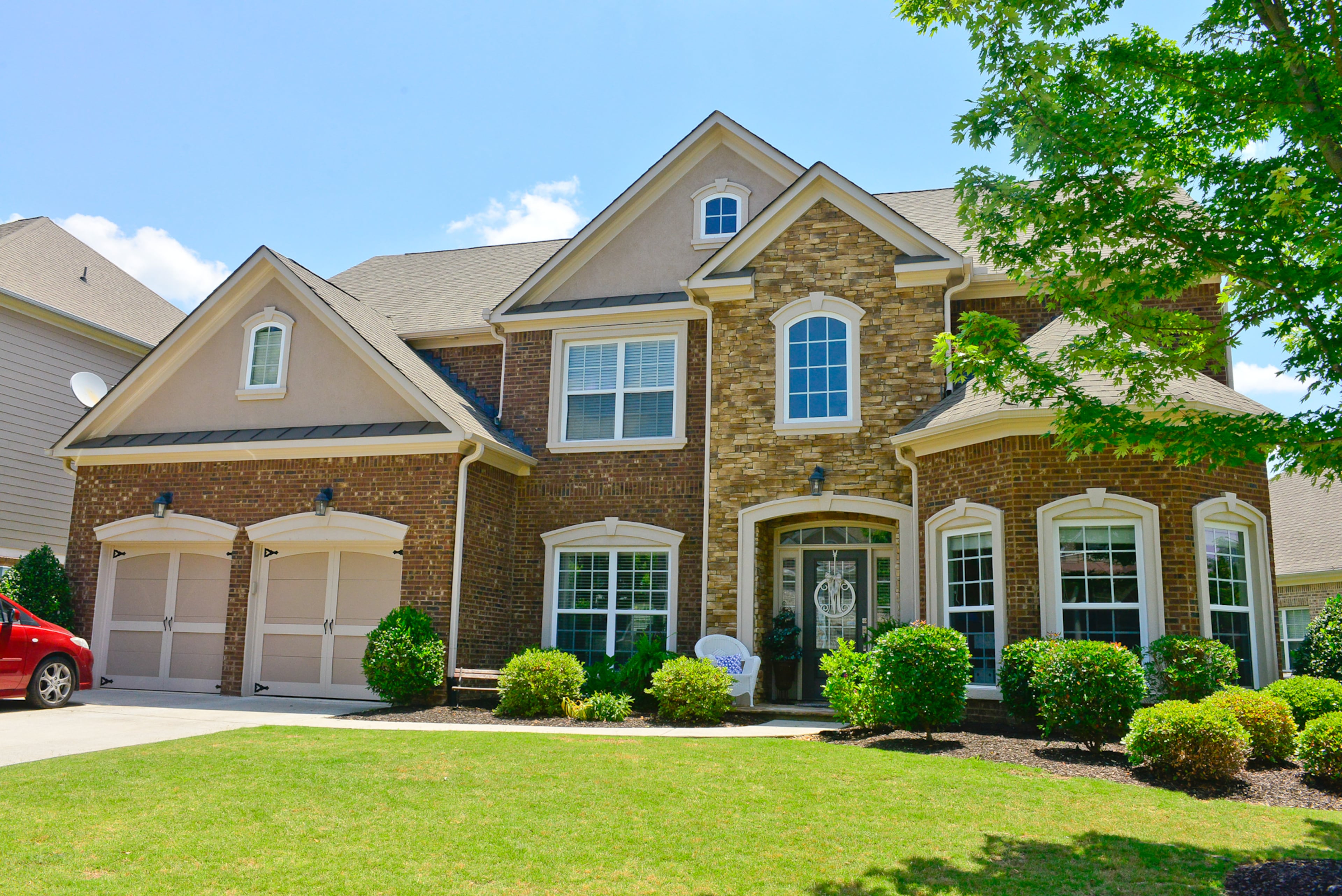 Exterior: Yuni and Jimmy Min moved to their home in Cumming in 2012. The home is 3,662 square feet, with five bedrooms, four full bathrooms and a large bay window that Yuni Min says is her favorite architectural feature.
