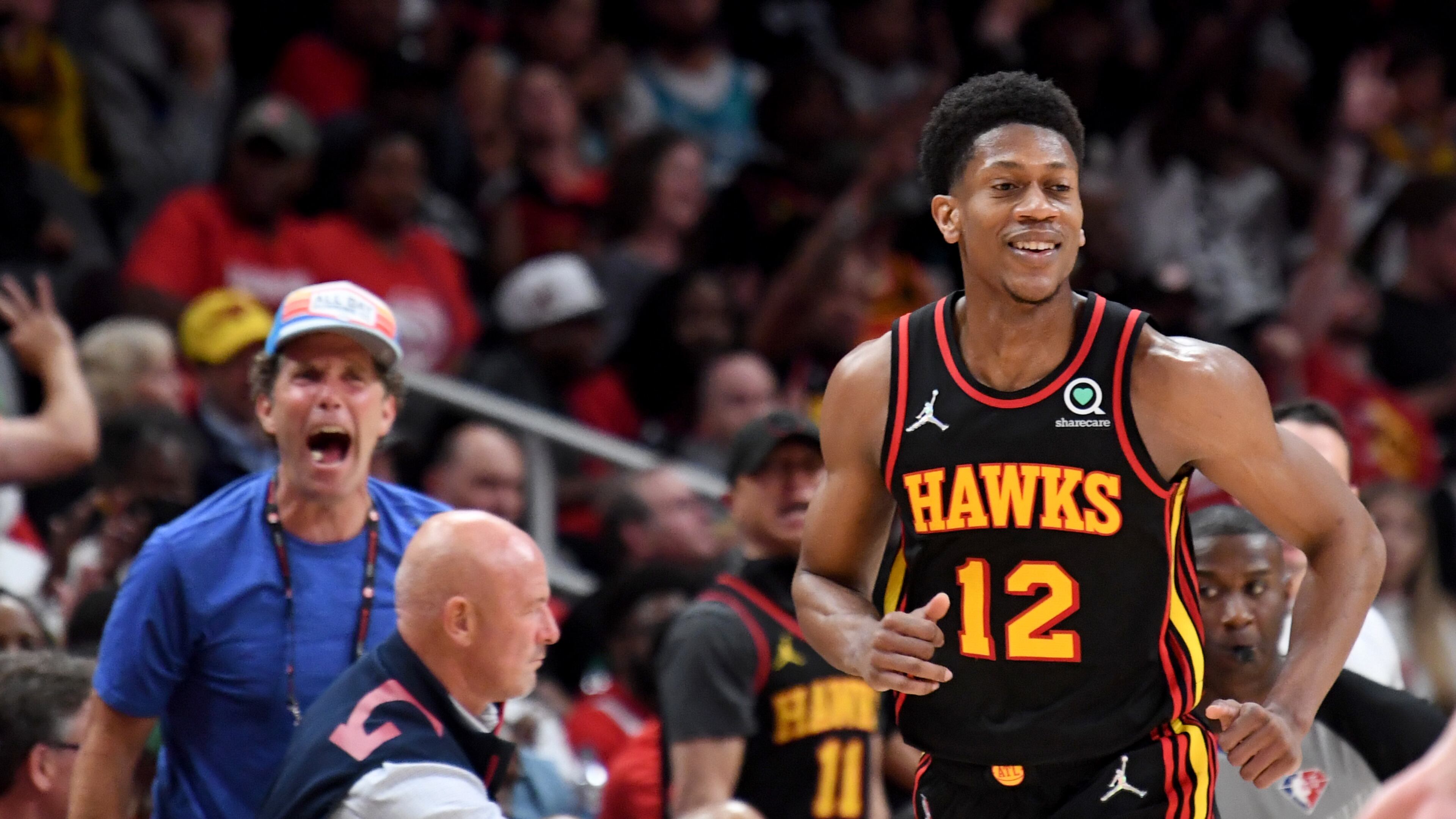 Hawks forward De'Andre Hunter (12) reacts after scoring during the second half. (Hyosub Shin / Hyosub.Shin@ajc.com)