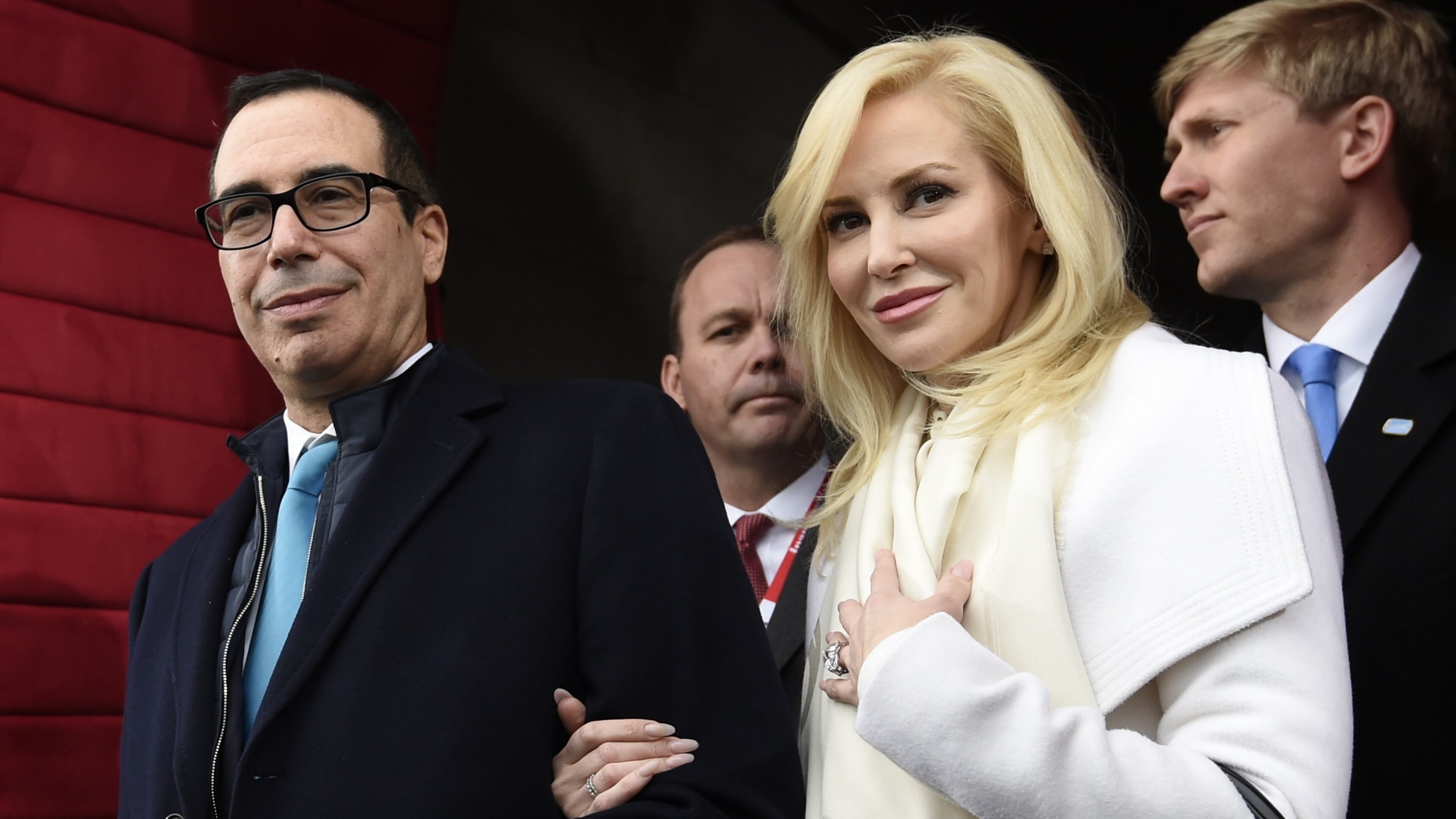 In this Friday, Jan. 20, 2017, file photo, then Treasury Secretary-designate Stephen Mnuchin and his then-fiancee, Louise Linton, arrive on Capitol Hill in Washington, for the presidential inauguration of Donald Trump. Linton responded to a social media critic on Aug. 21, 2017, telling the mother of three that that she was "adorably out of touch." Mnuchin and Linton were married in June. (Saul Loeb/Pool Photo via AP, File)