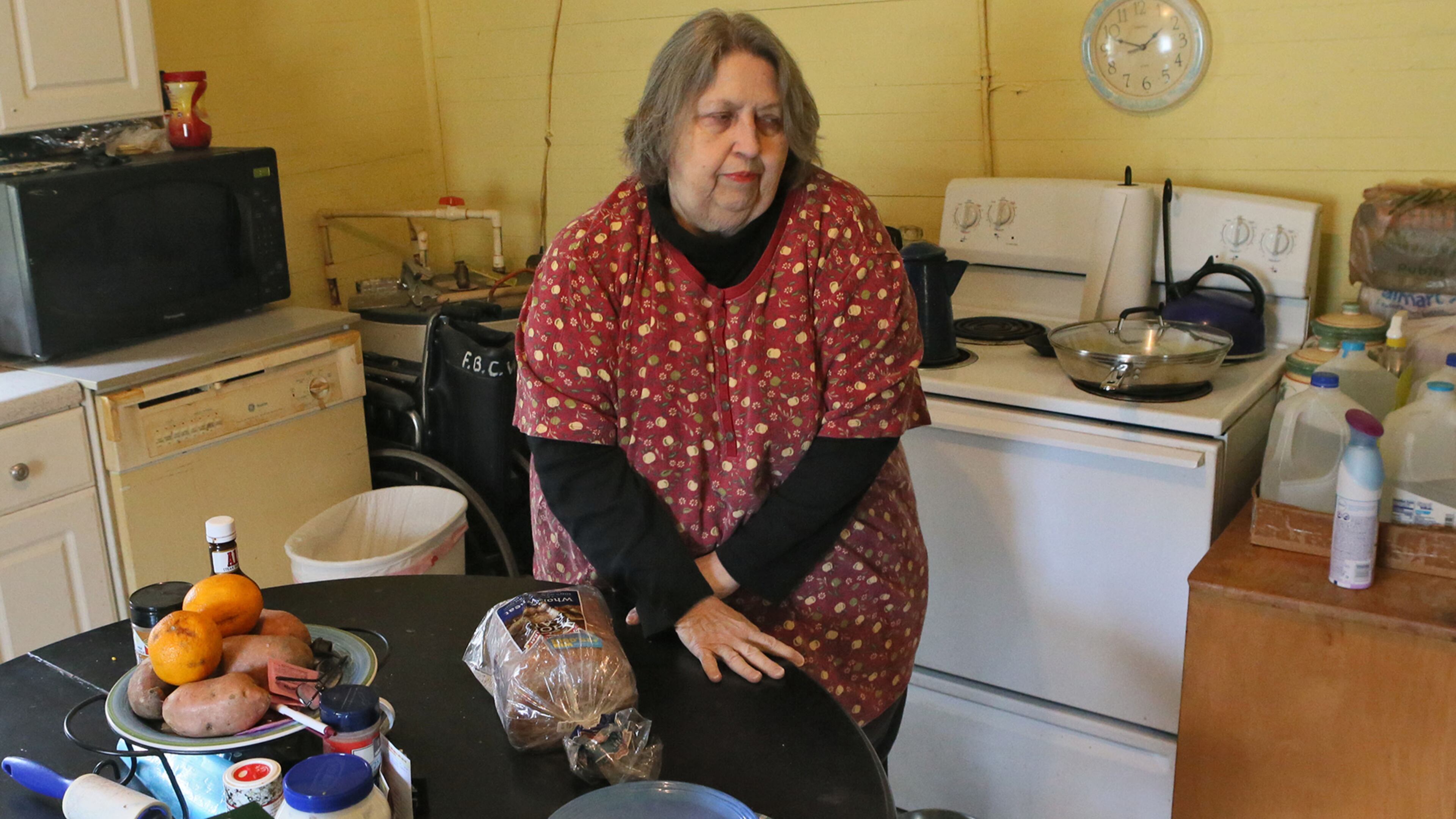 March 27, 2014 - Ball Ground - Jo Ann de la Moriniere, 73, who says she has had a lot of trouble with her food stamps, prepares lunch at her home in Ball Ground. Georgia's problem-wracked food stamp system continues to block people from getting the assistance. Much of the problem focuses on the flawed call-in center, which people use to apply and ask questions and undergo interviews. In January, nearly half of the callers could not get through. Wait times stretch over hours. The agency has a 40,000 case backlog. BOB ANDRES / BANDRES@AJC.COM