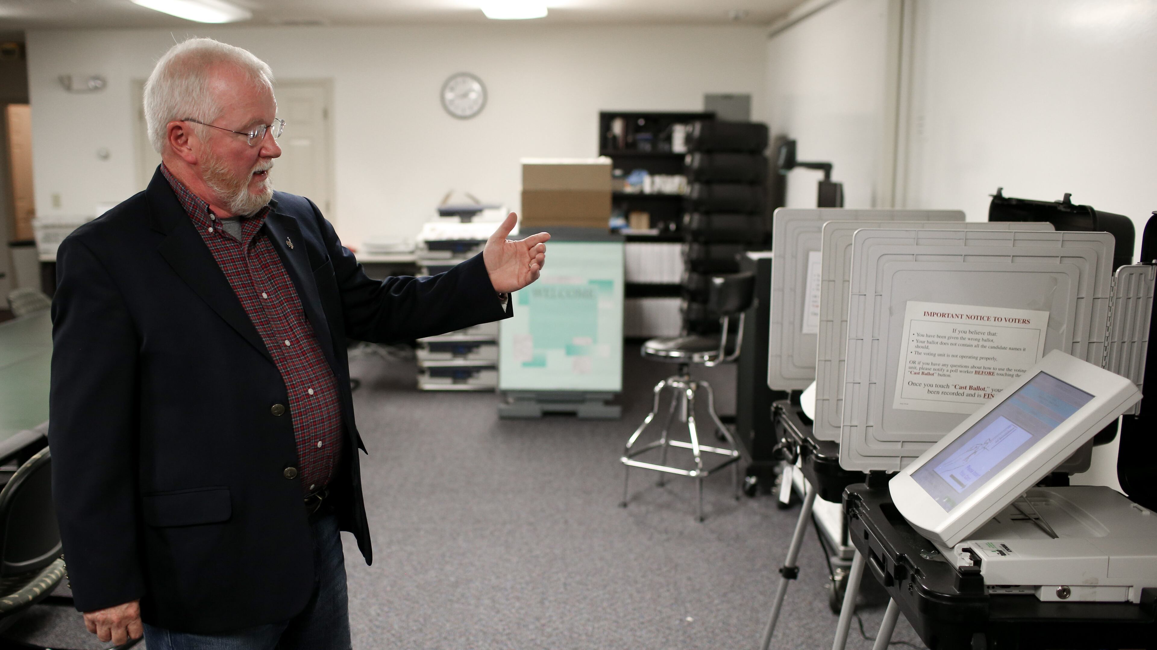Merle King, executive director for the Center for Election Systems at Kennesaw State University, explains how a DRE, a touchscreen machine voters use when casting their ballot, works, Thursday, Oct. 20, 2016, in Kennesaw, Ga. BRANDEN CAMP/SPECIAL