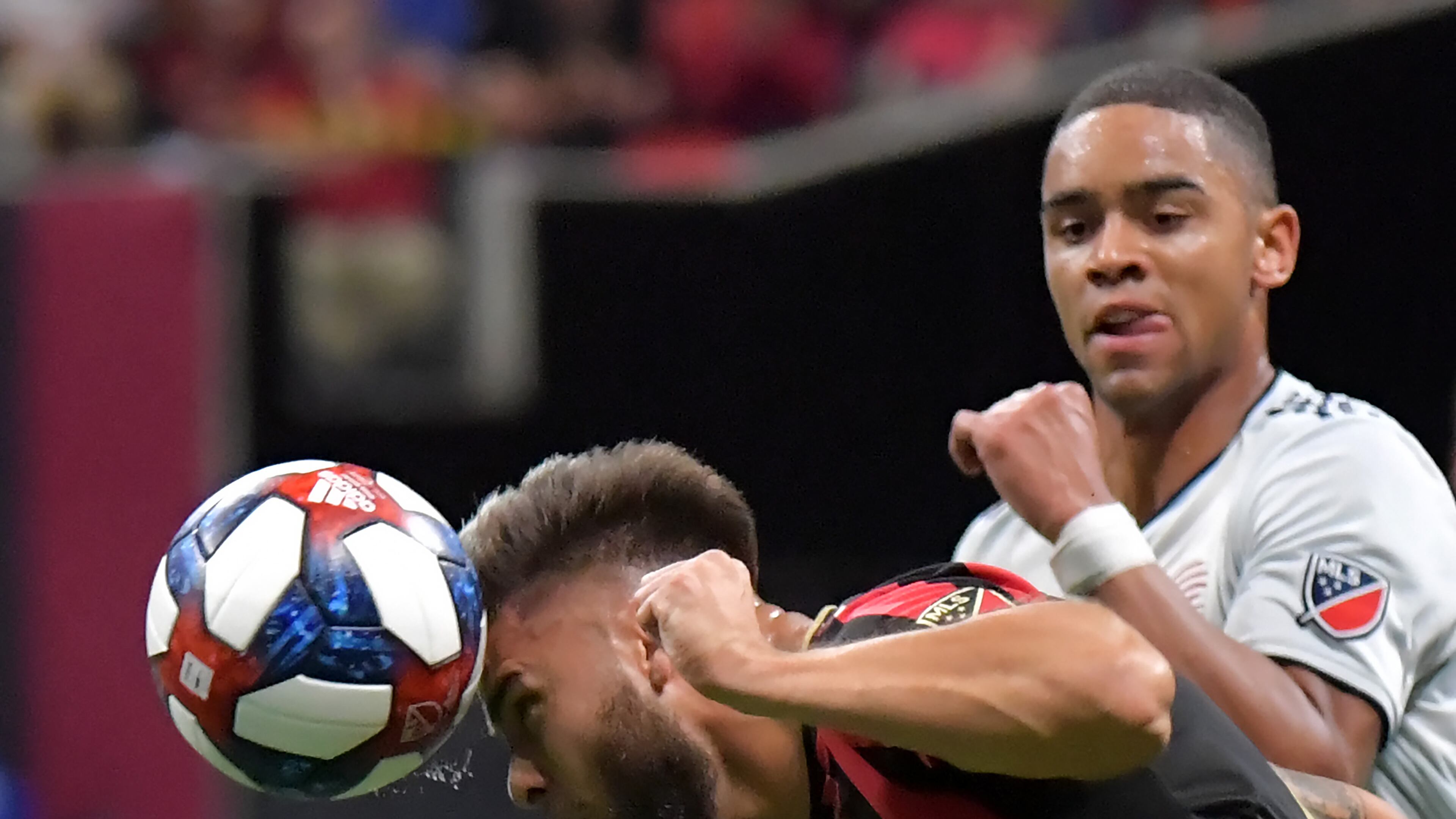 October 19, 2019 Atlanta - Atlanta United forward Hector Villalba (15) heads the ball over New England Revolution midfielder Brandon Bye (15) in the second half during the first round of the MLS playoffs at Mercedes-Benz Stadium on Saturday, October 19, 2019. Atlanta United won 1-0 over the New England Revolution. (Hyosub Shin / Hyosub.Shin@ajc.com)