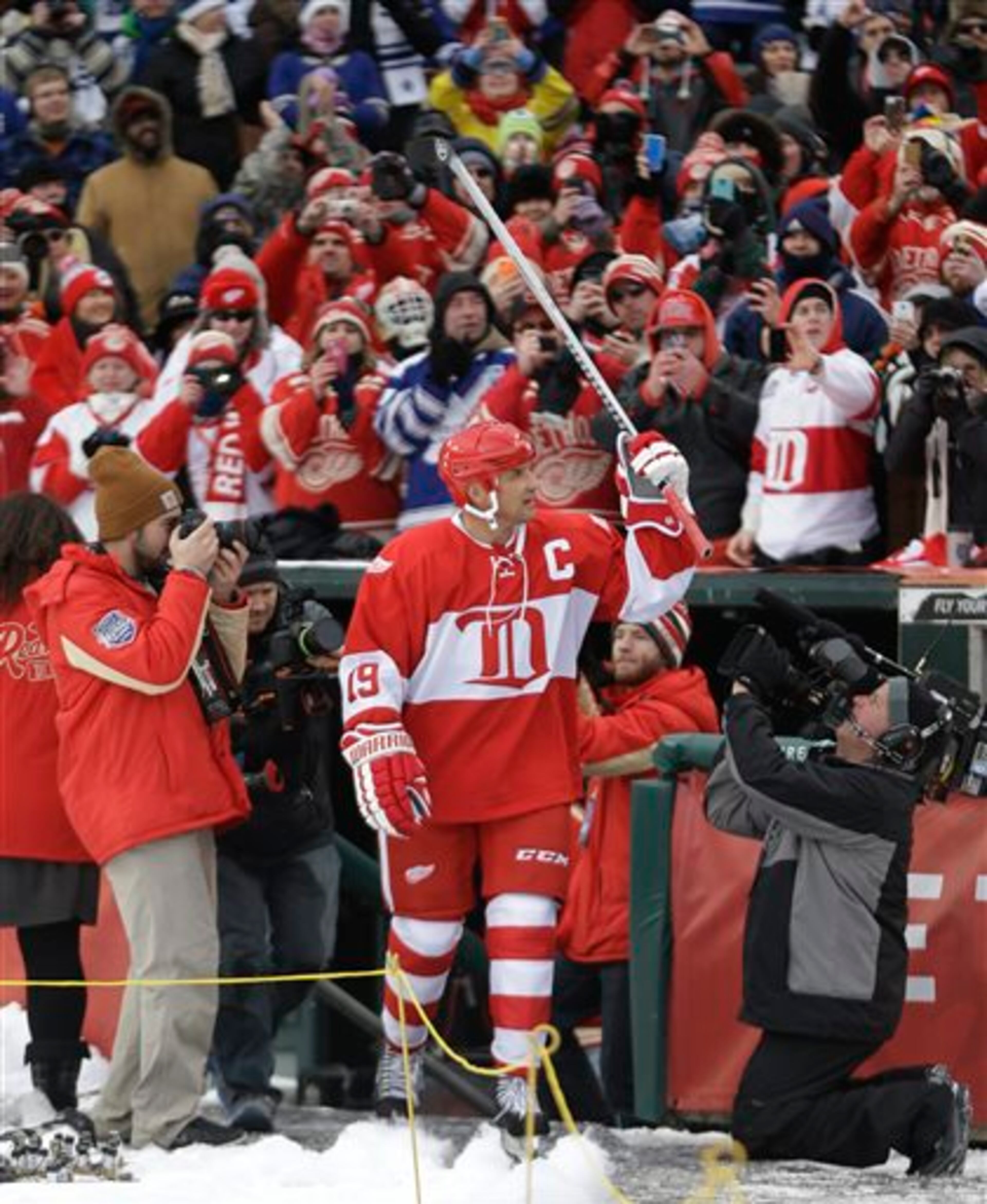 Detroit Red Wings forward Steve Yzerman is introduced before the Winter Classic alumni outdoor NHL hockey game at Comerica Park in Detroit, Tuesday, Dec. 31, 2013. (AP Photo/Carlos Osorio)