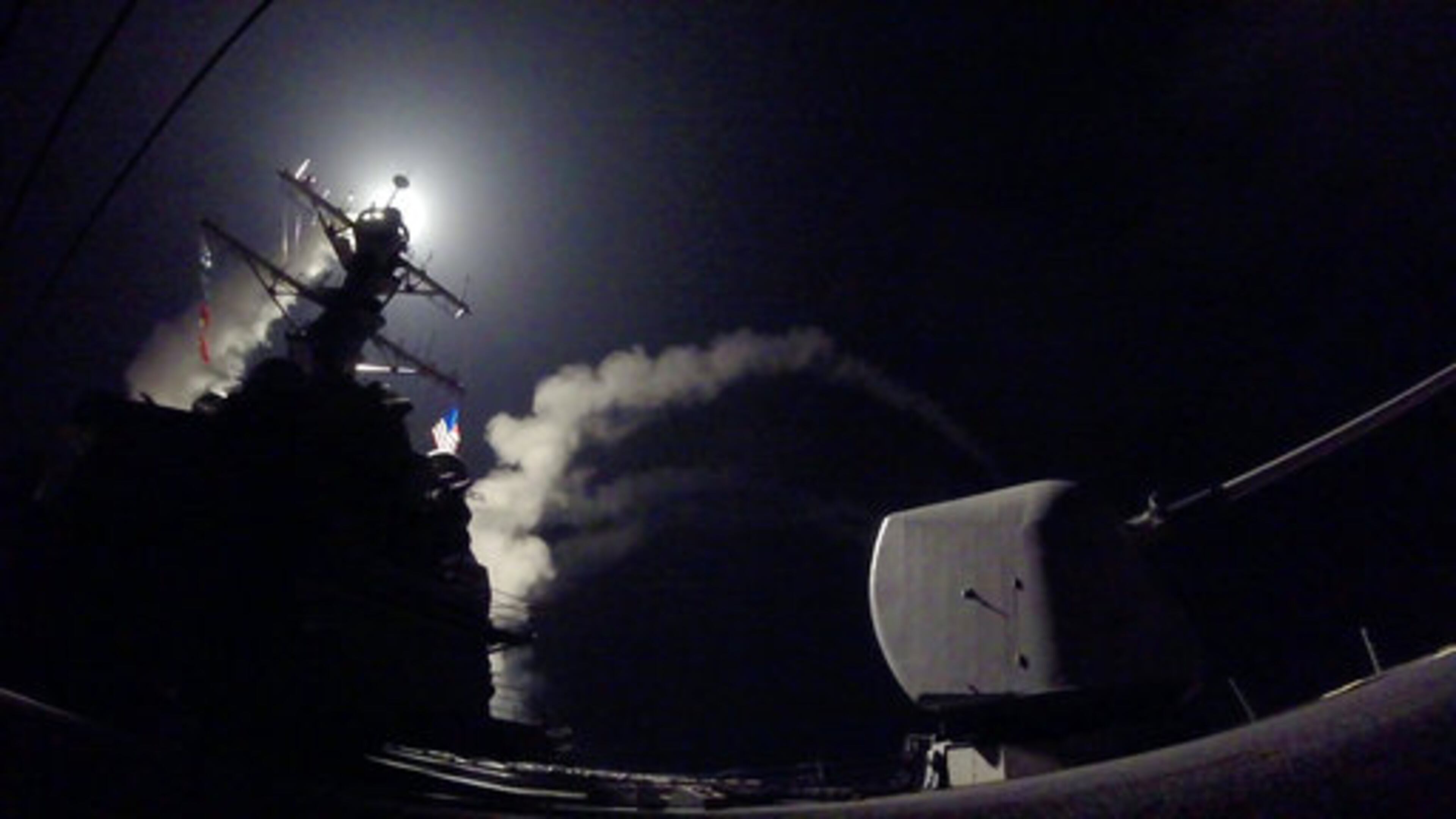 In this image provided by the U.S. Navy, the guided-missile destroyer USS Porter (DDG 78) launches a tomahawk land attack missile in the Mediterranean Sea, Friday, April 7, 2017. The United States blasted a Syrian air base with a barrage of cruise missiles in fiery retaliation for this week's gruesome chemical weapons attack against civilians. (Mass Communication Specialist 3rd Class Ford Williams/U.S. Navy via AP)