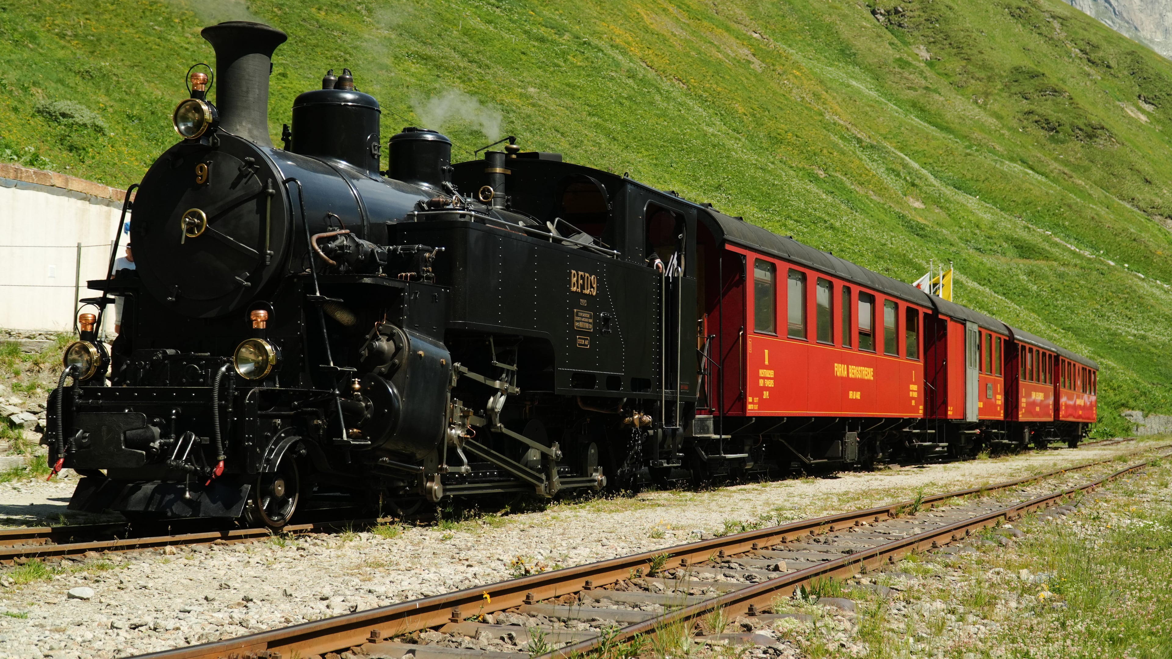 One of DFB's historic steam trains travels from Realp to Oberwald during a stop at the Furka station, Switzerland, Friday, June 26, 2026. (AP Photo/Niccolo Lupone)
