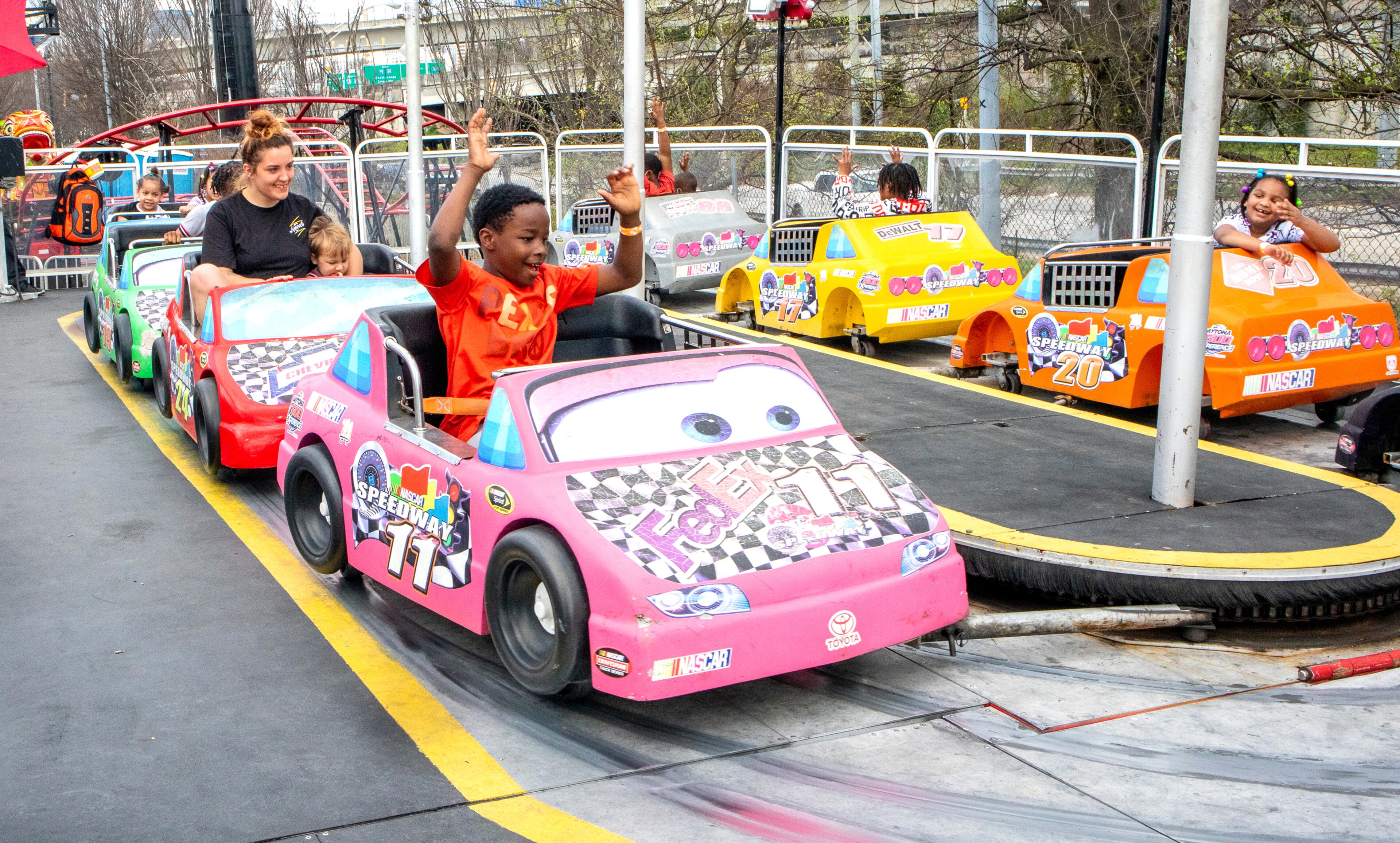 Kids (and an occasional parent) enjoy the rides at the Atlanta Fair on Sunday, March 6, 2022. (Photo by Steve Schaefer for The Atlanta Journal-Constitution)