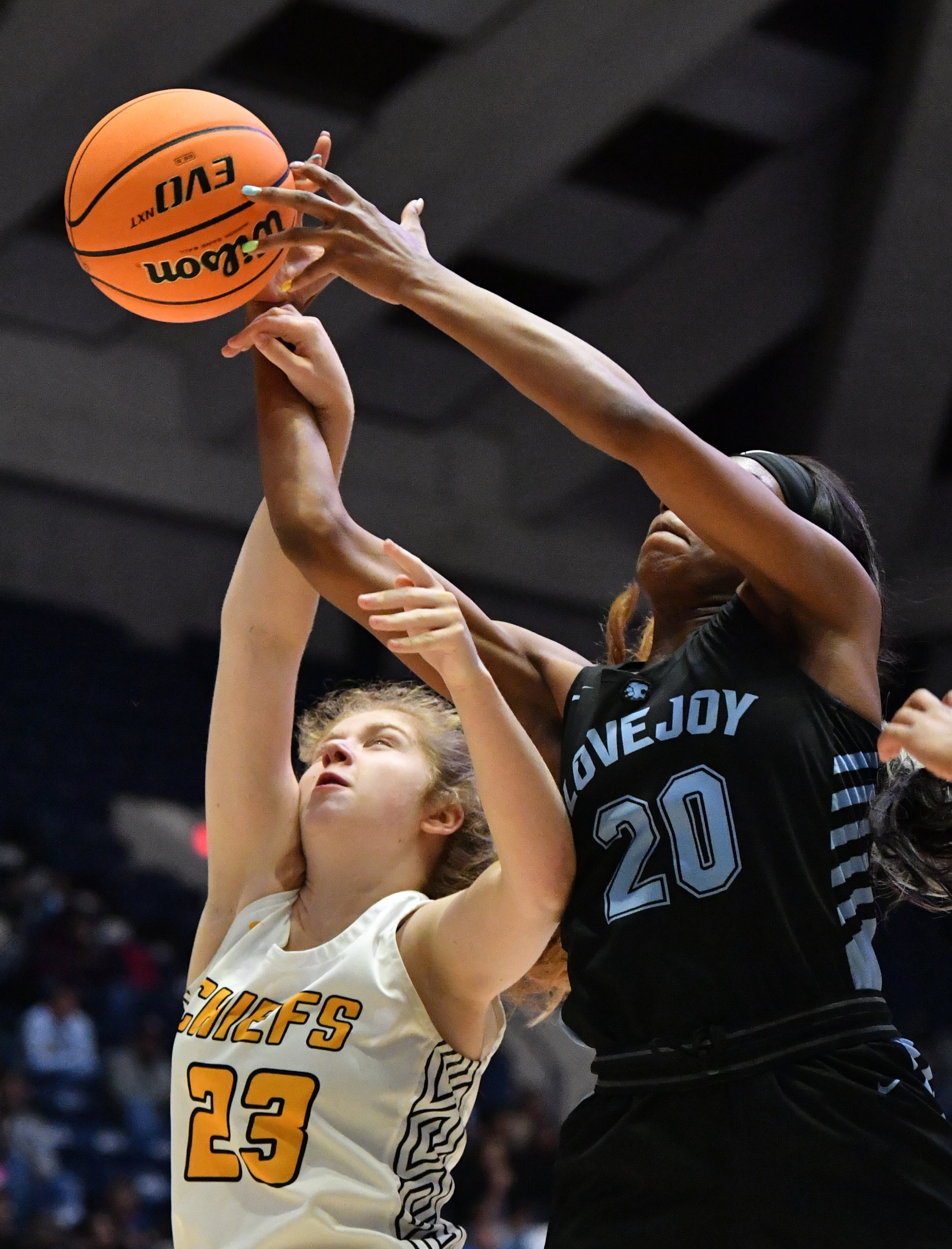 March 11, 2022 Macon - Lovejoy's Bryana Hardy (20) grabs a rebound over Sequoyah's Sayler Davies (23) during the 2022 GHSA State Basketball Class AAAAAA Girls Championship game at the Macon Centreplex in Macon on Friday, March 11, 2022. Lovejoy won 54-38 over Sequoyah. (Hyosub Shin / Hyosub.Shin@ajc.com)