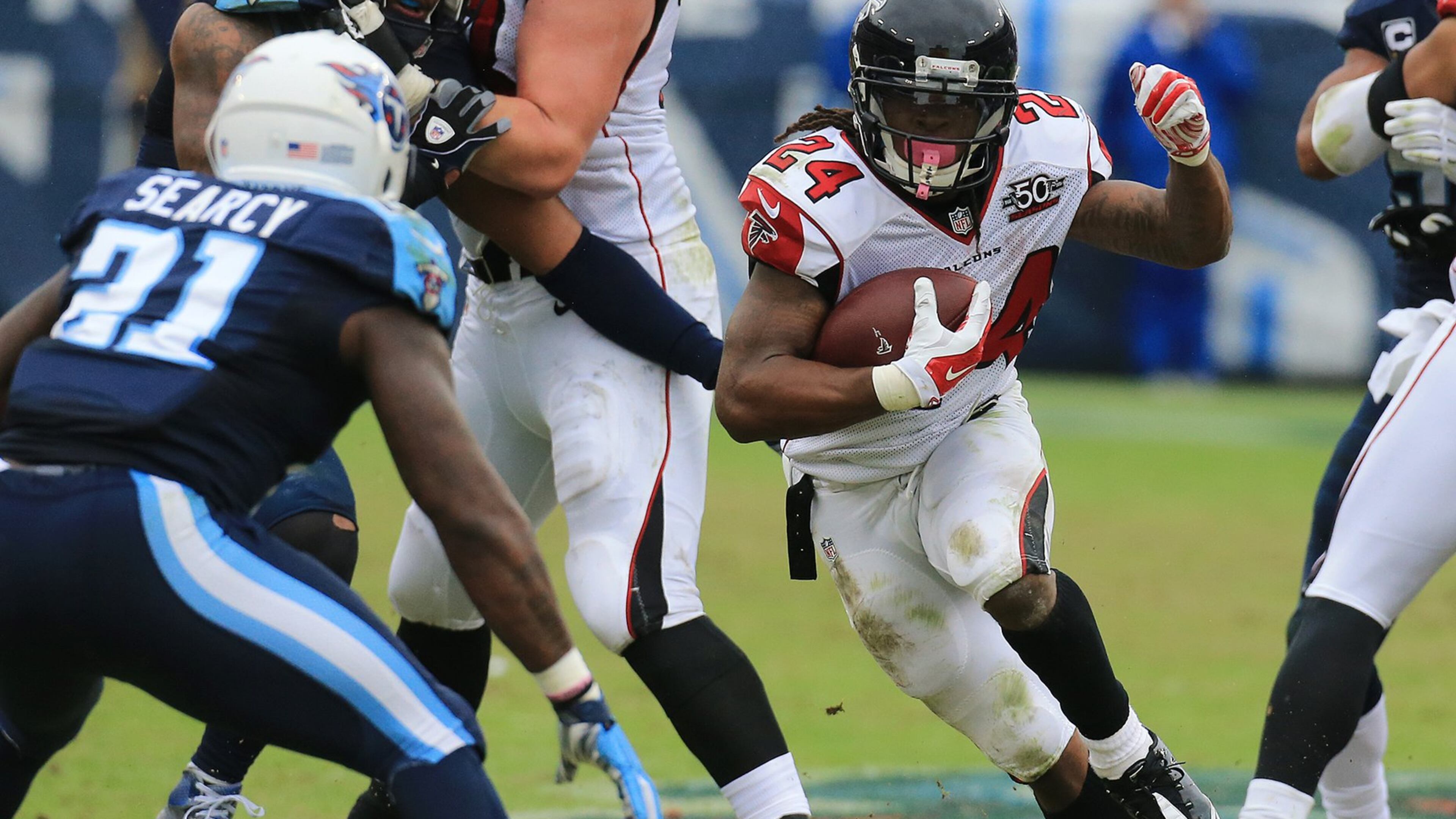 102515 NASHVILLE: -- Falcons wide reciever Julio Jones makes a first down catch against Titans cornerback Coty Sensabaugh in a football game on Sunday, Oct. 25, 2015, in Nashville. Curtis Compton / ccompton@ajc.com