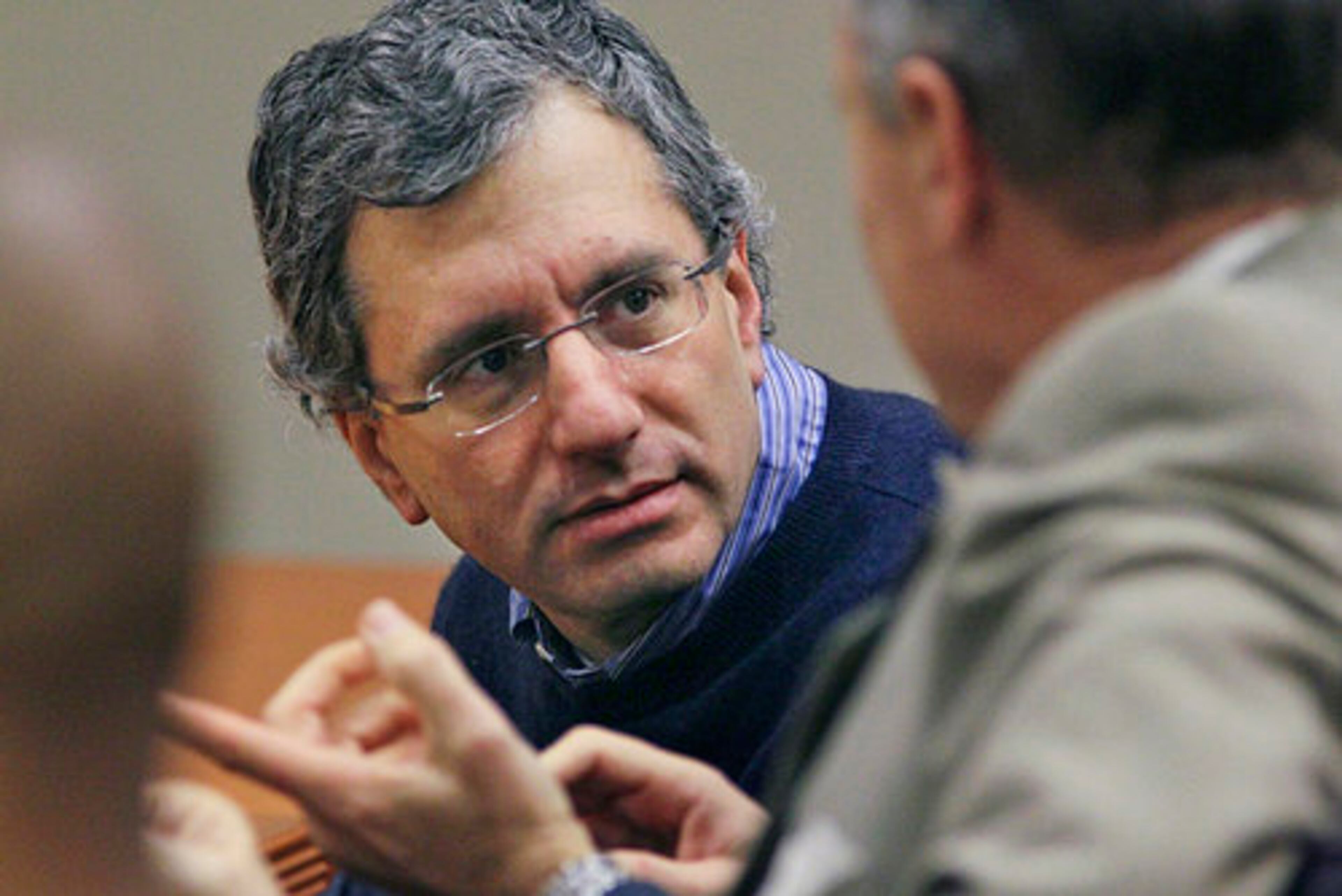 Neuman (left) listens to attorney Doug Peters (right). The jury entered its second full day of deliberations Thursday.