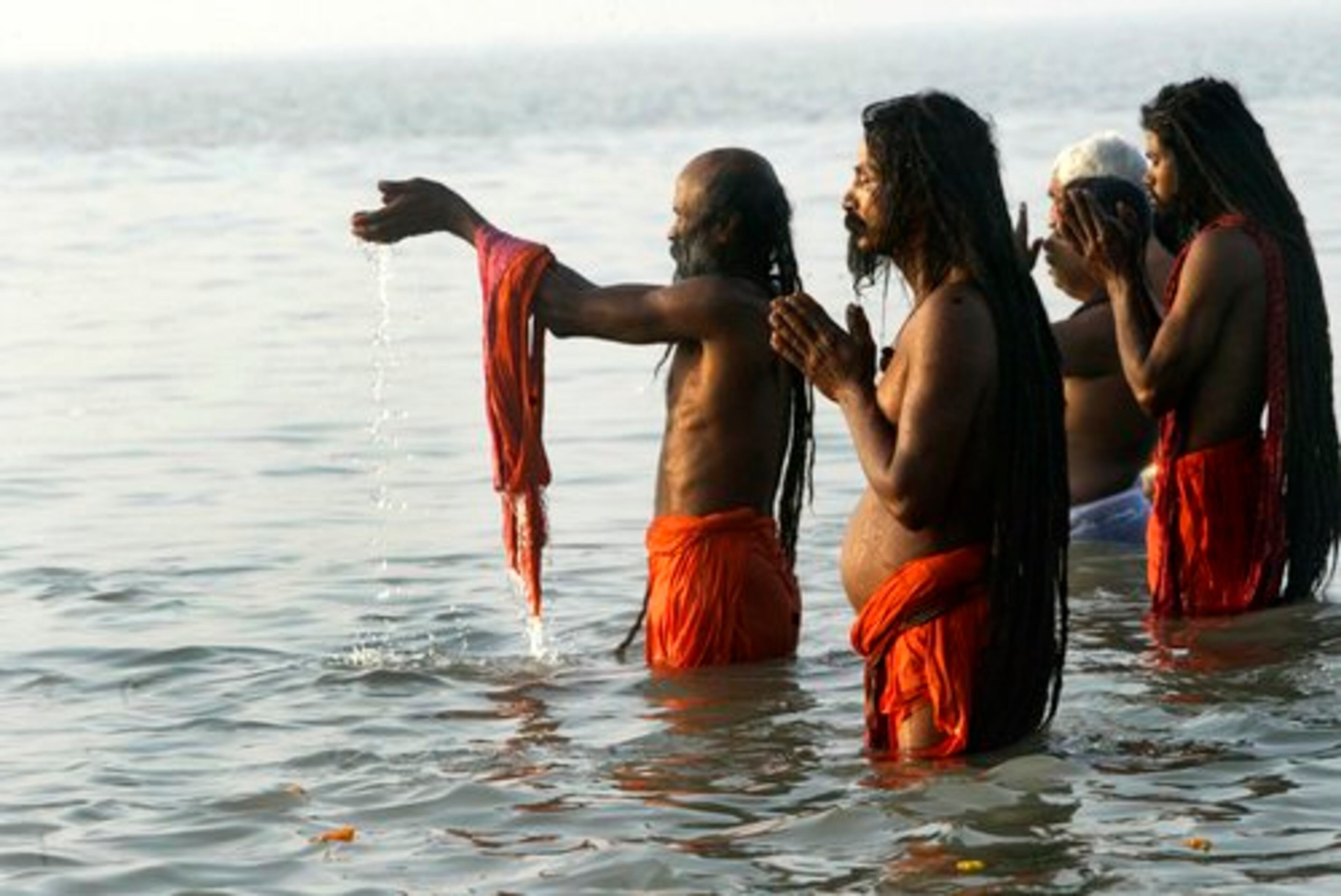 HINDU HOLY men offer prayers while wading in the Ganges during the Makar Sankranti festival. India has always been popular among tourists seeking a sort of spirituality, but that tourist base is broadening now.