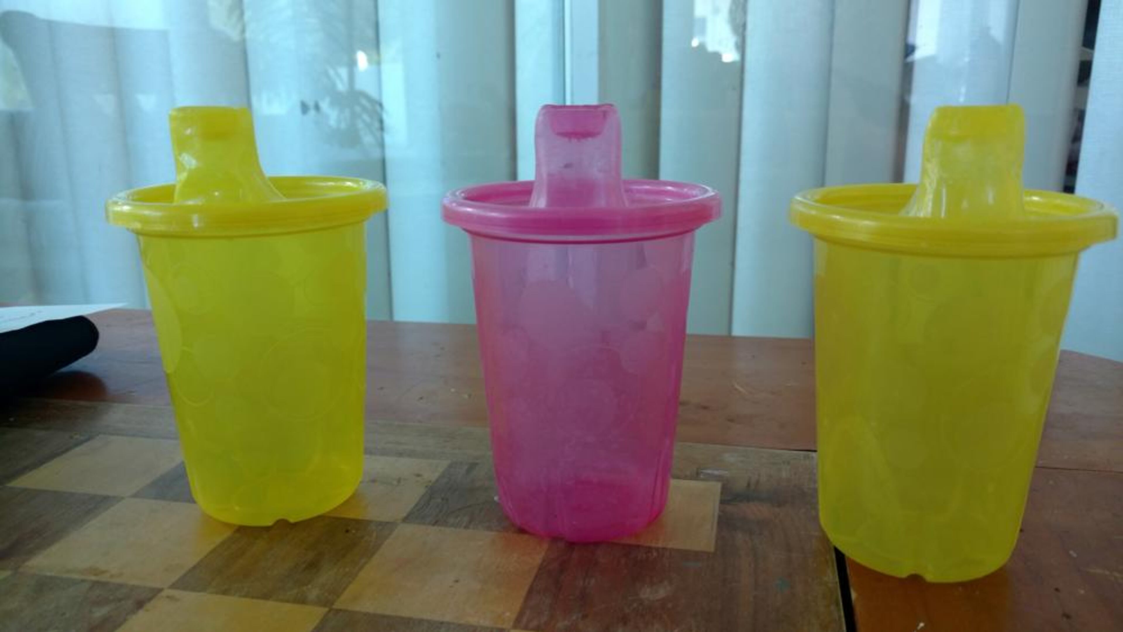 A Georgia woman smuggled alcohol into a theater using her son's sippy cup, police say.