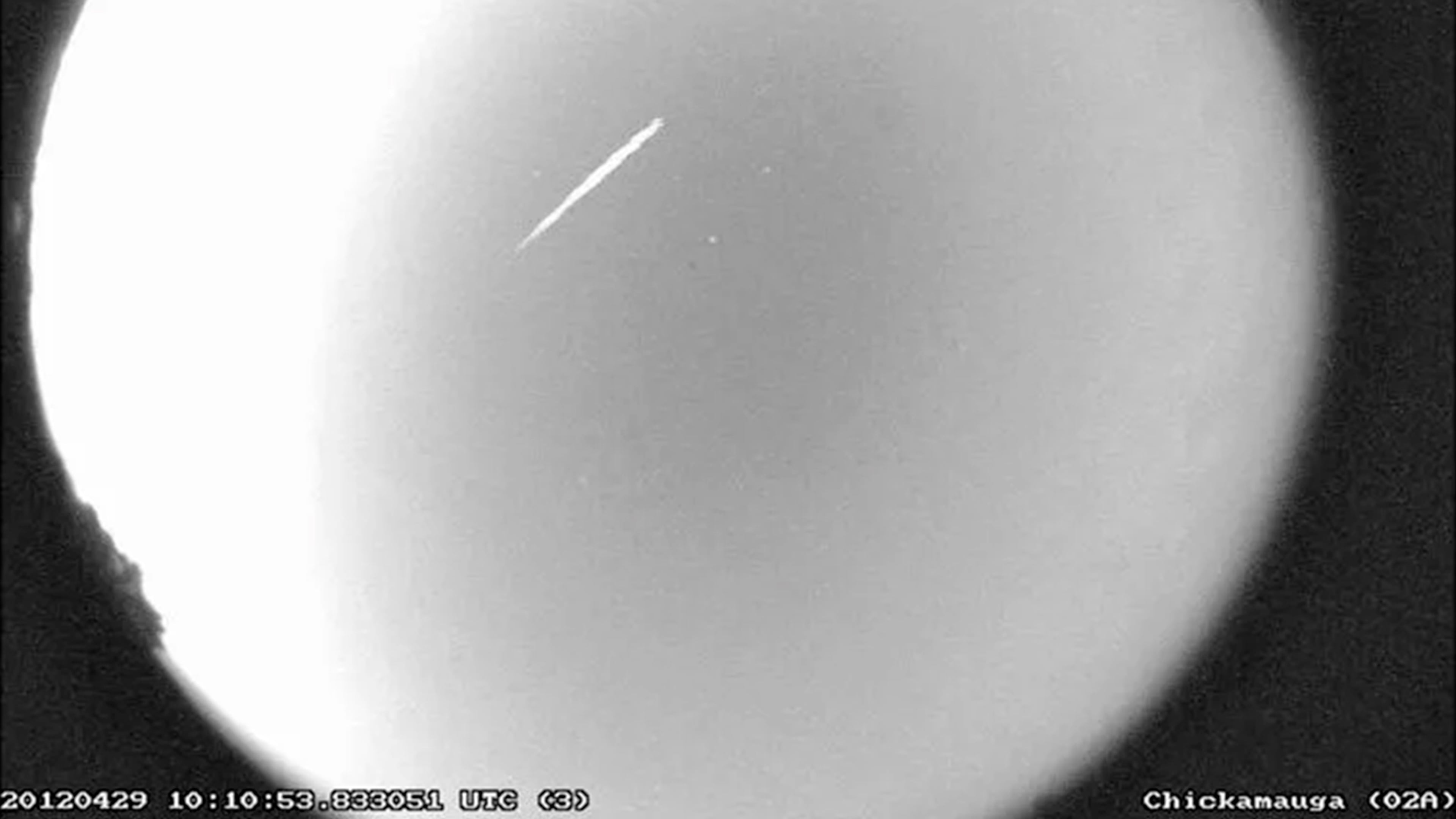 FILE - This photo provided by NASA shows an Eta Aquarid meteor streaking over northern Georgia on April 29, 2012. (B. Cooke/Marshall Space Flight Center/NASA via AP, File)
