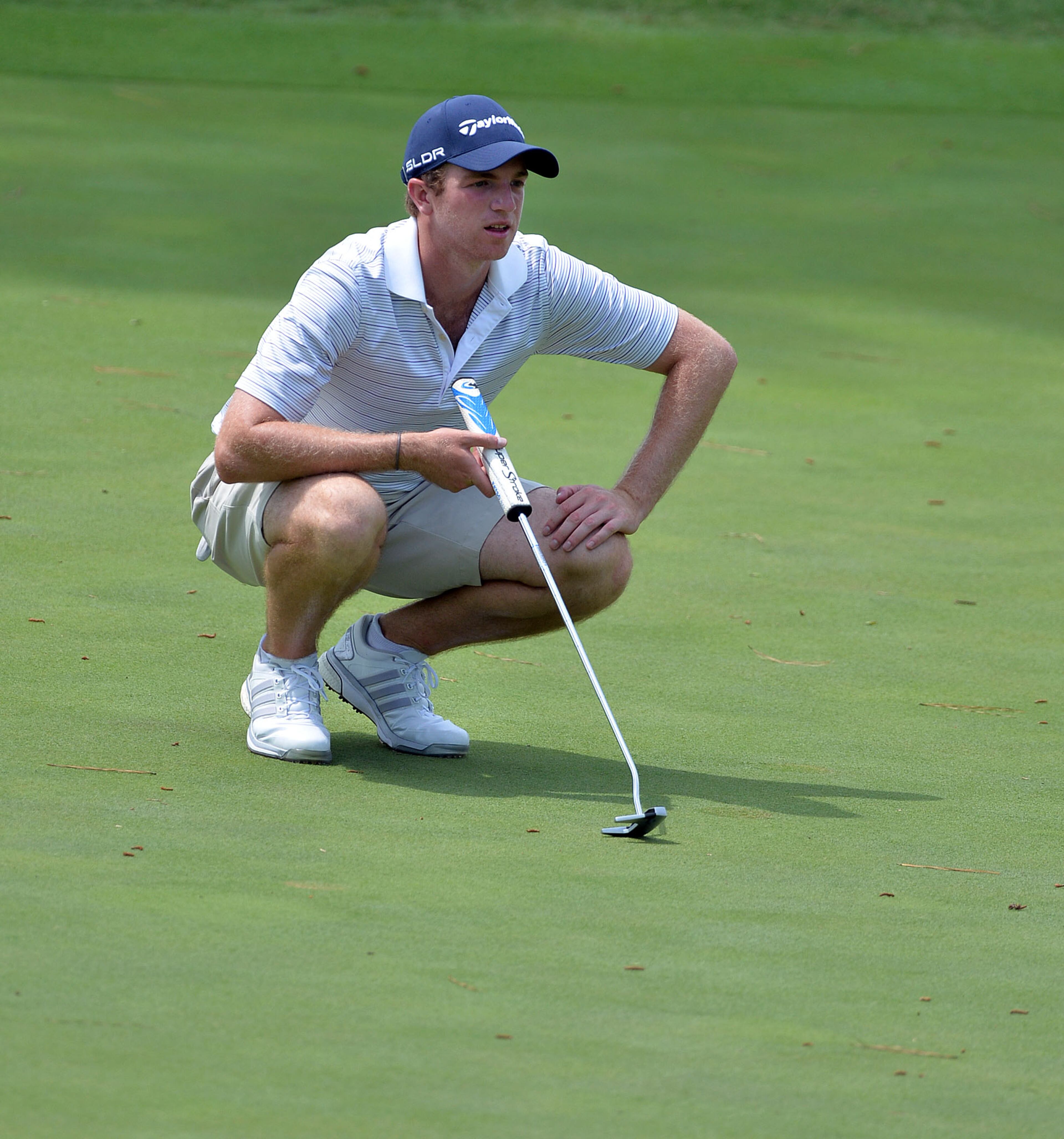 JUNE 8, 2015 BALL GROUND Franco Castro, of Alpharetta, checks his putt on the #16 green. Those who qualify advance to next week's U.S. Open at Chambers Bay, University Place, Washington. KENT D. JOHNSON /KDJOHNSON@AJC.COM