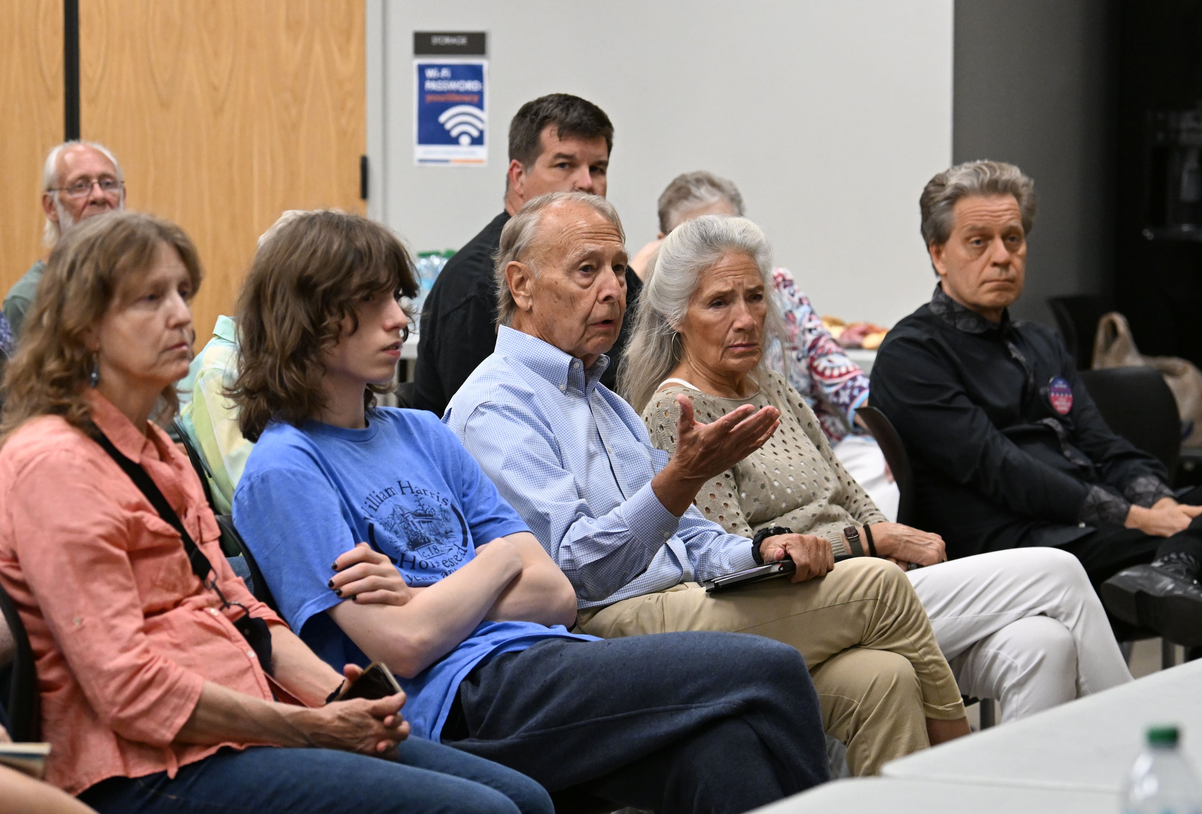 Hunter Tison (center) questions Democratic members of the Georgia state House during a community conversation on taxes at the Bogart Library on Tuesday. (Hyosub Shin/AJC)