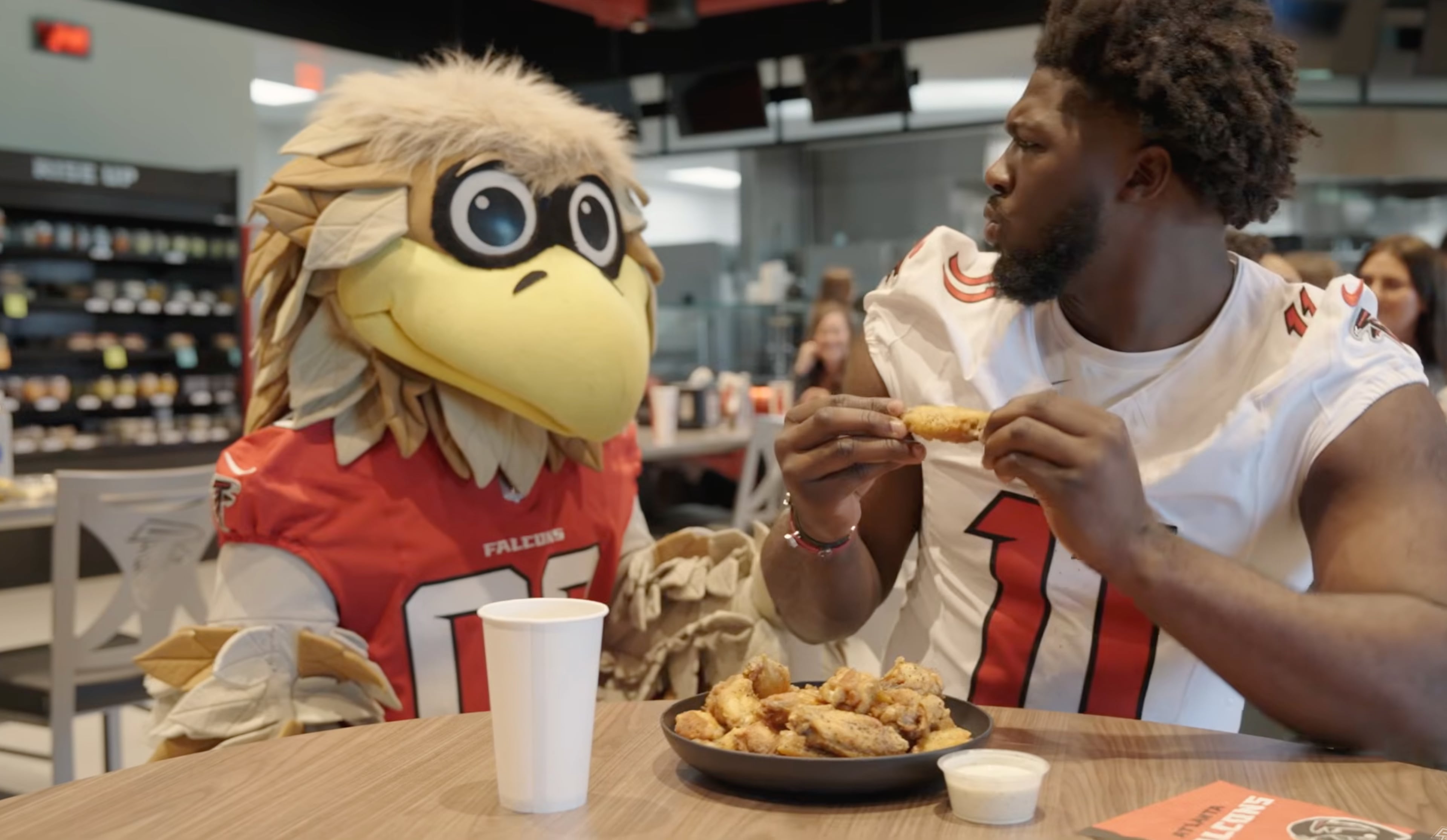 Jalon Walker learns that eating chicken wings is an at-your-own-risk activity. (atlantafalcons.com)