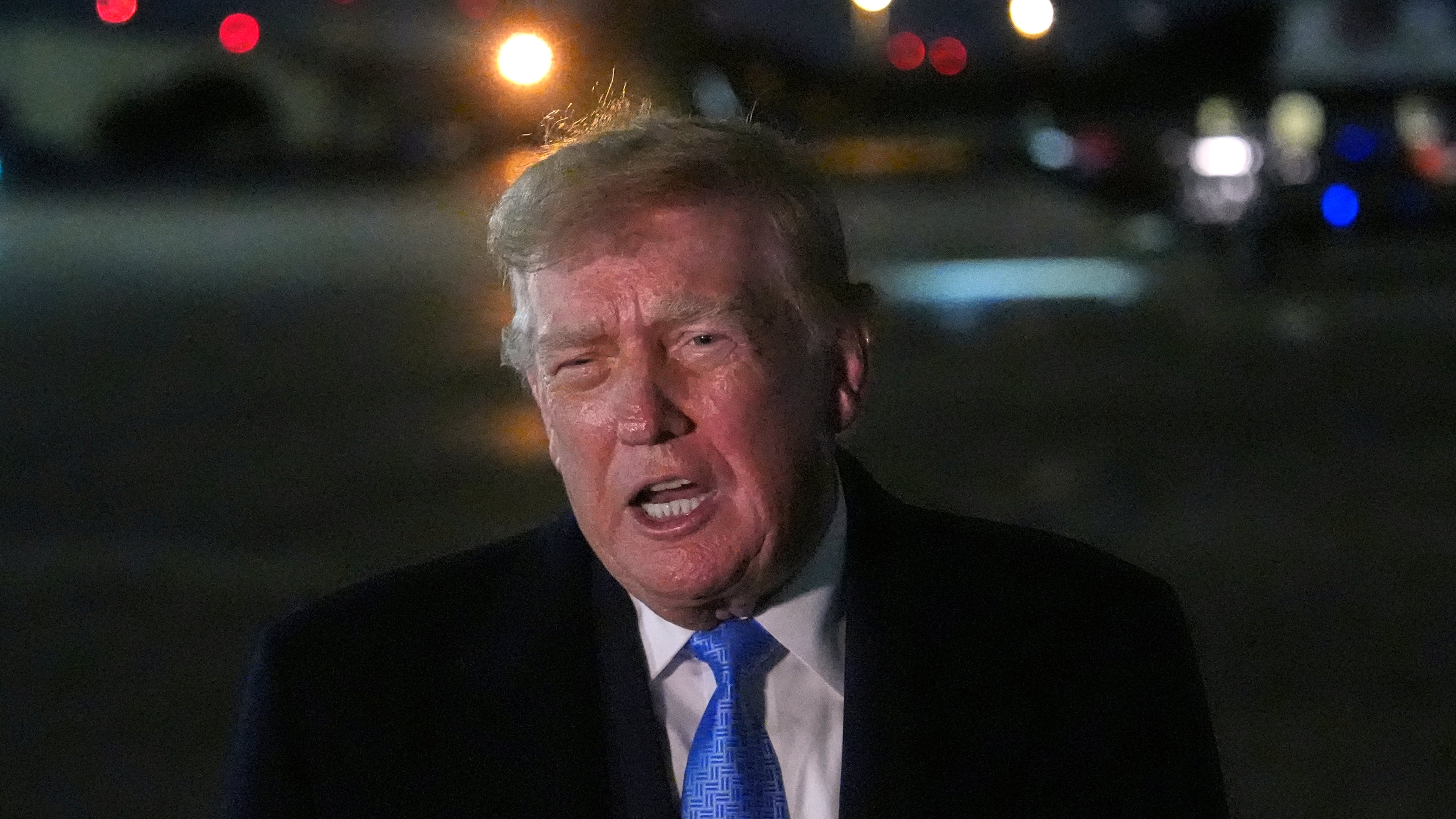 President Donald Trump speaks with reporters upon arriving, Sunday, Sept. 27, 2026, at Joint Base Andrews, Md. (AP Photo/Julia Demaree Nikhinson)