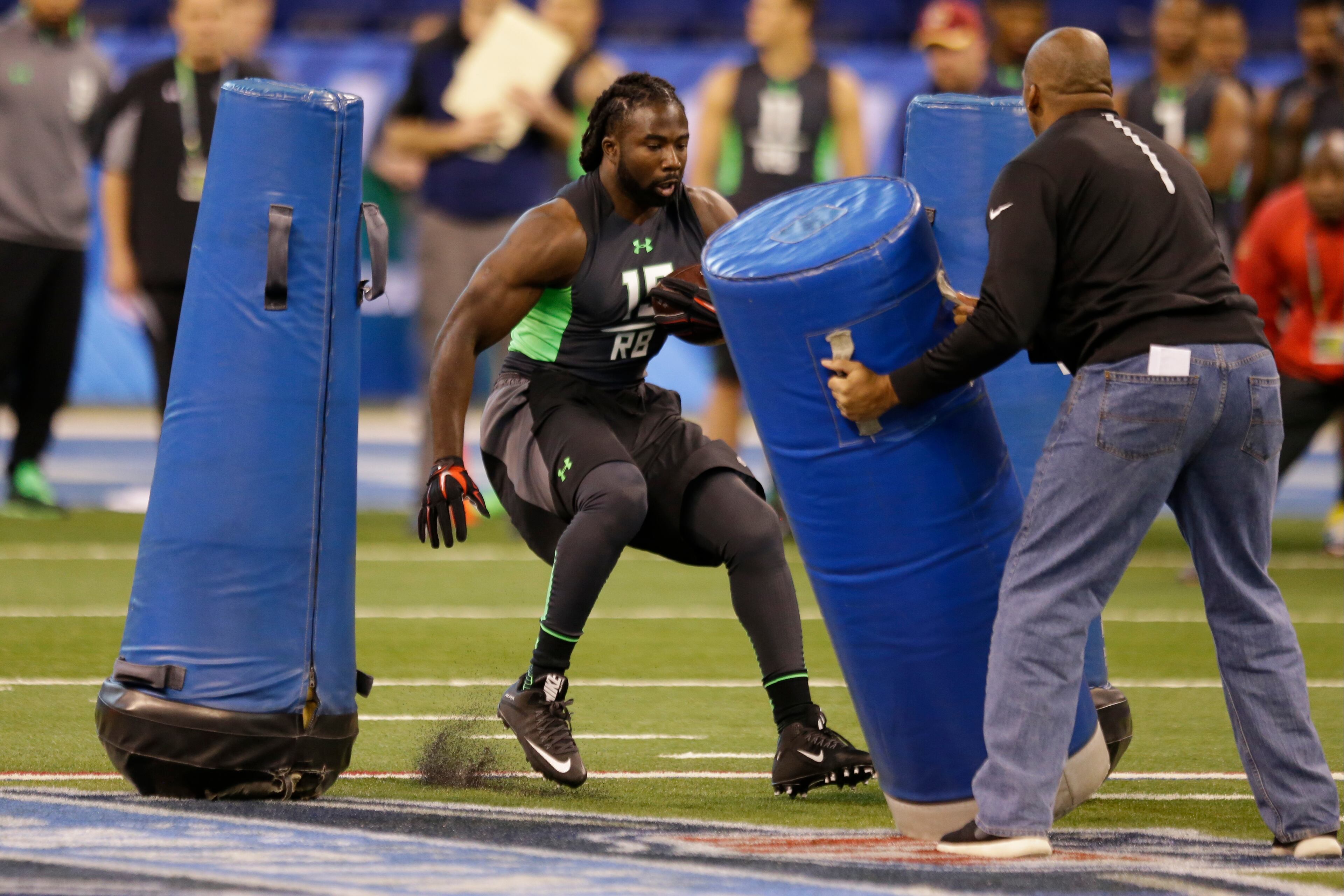 Georgia running back Keith Marshall runs a drill at the NFL football scouting combine in Indianapolis, Friday, Feb. 26, 2016. (AP Photo/Michael Conroy)