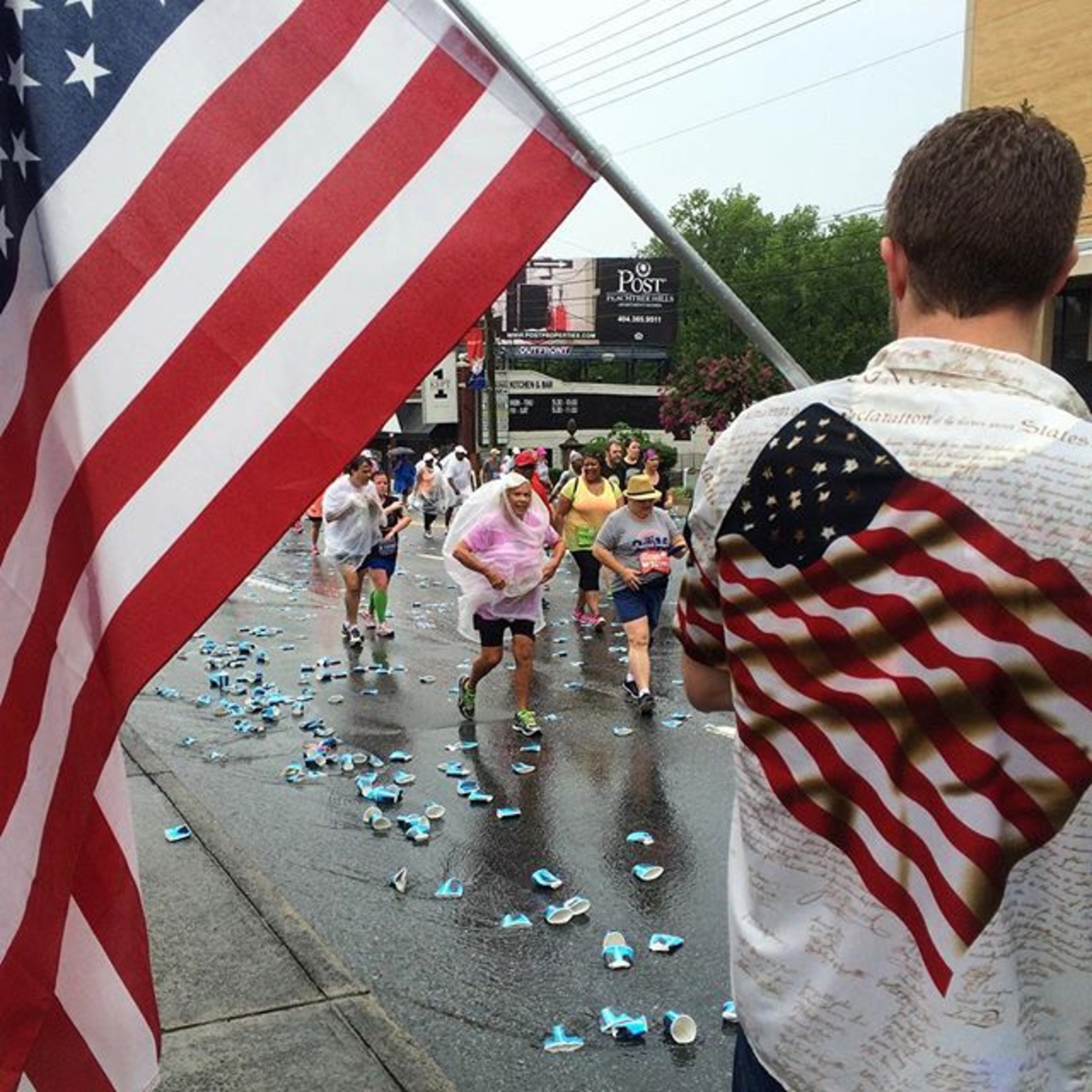@photobgray: #runography Alex Connelly cheers on runners during the 2015 AJC Peachtree Road Race. See full coverage on AJC.com and in the Sunday AJC.
