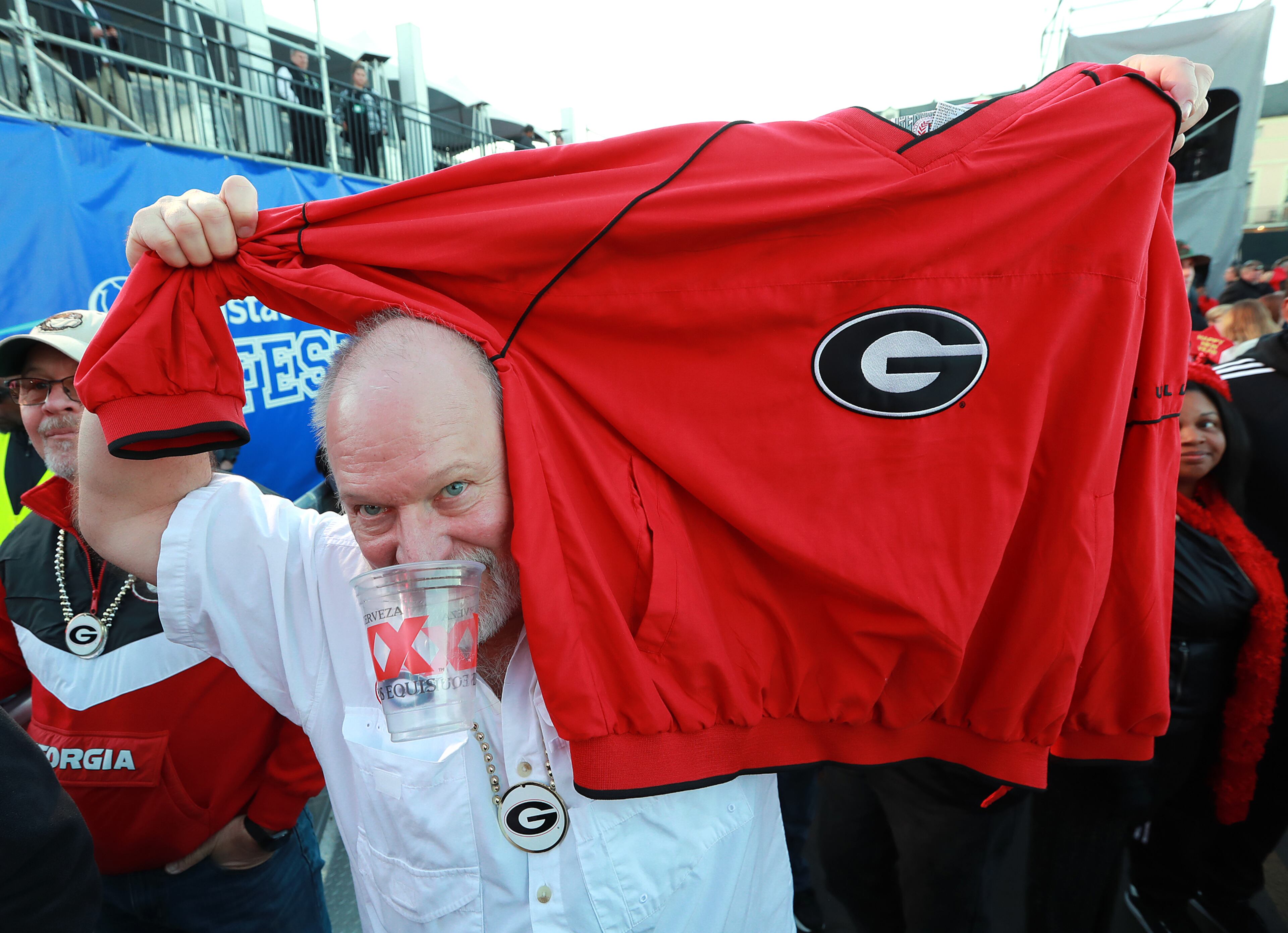 Georgia fan Joel Cole shows his support during the pep rally. Curtis Compton ccompton@ajc.com