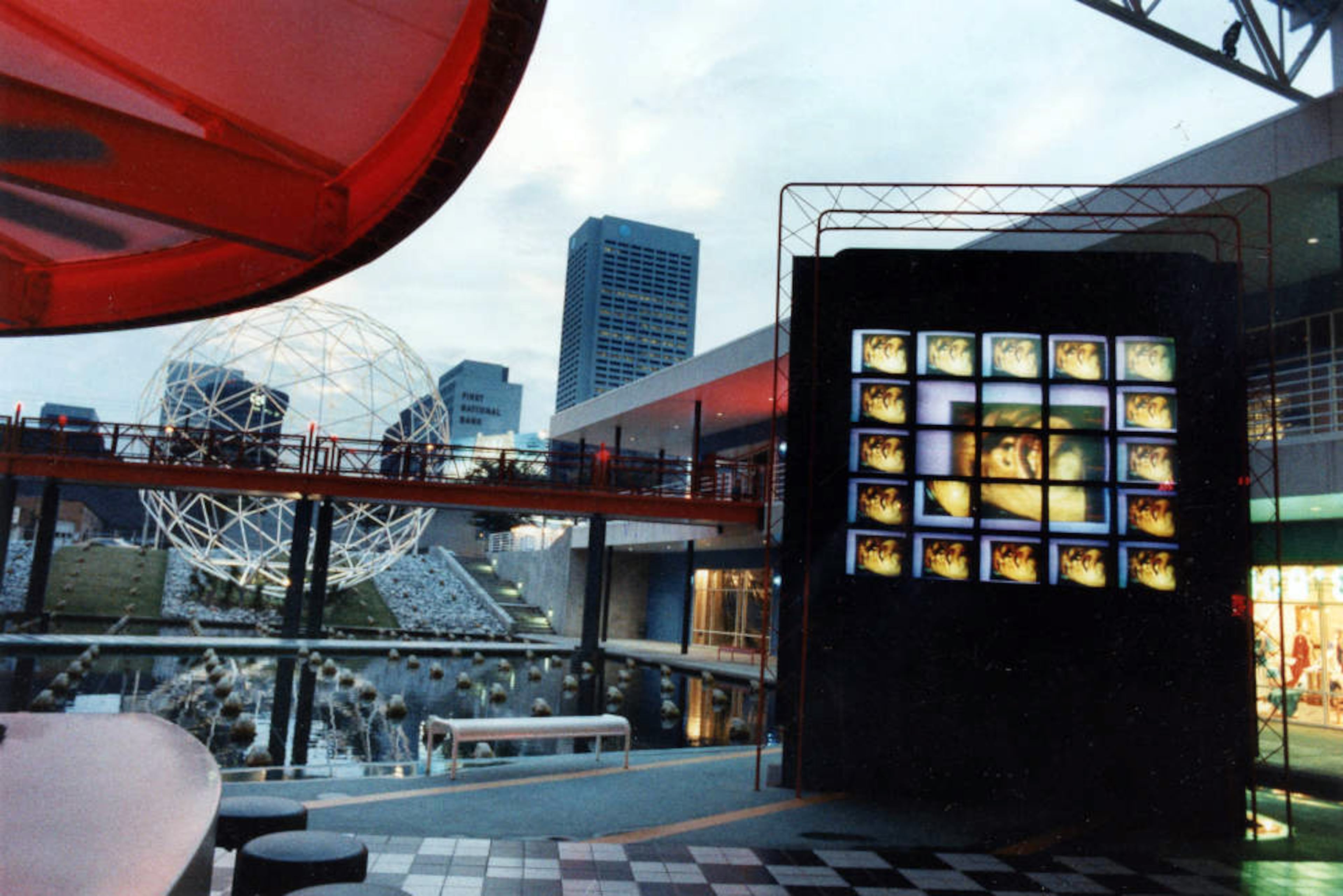 Pedestrian bridges and a pond dotted with golden frogs at the Rio Shopping Center, looking west toward Midtown on September 12, 1993. According to the story at the time, business was picking up there. It wouldn't last, though. The state-of-the-art center (check out the fancy video wall), which opened in 1988 at the corner of Piedmont and North aveneues, was torn down in 2000.