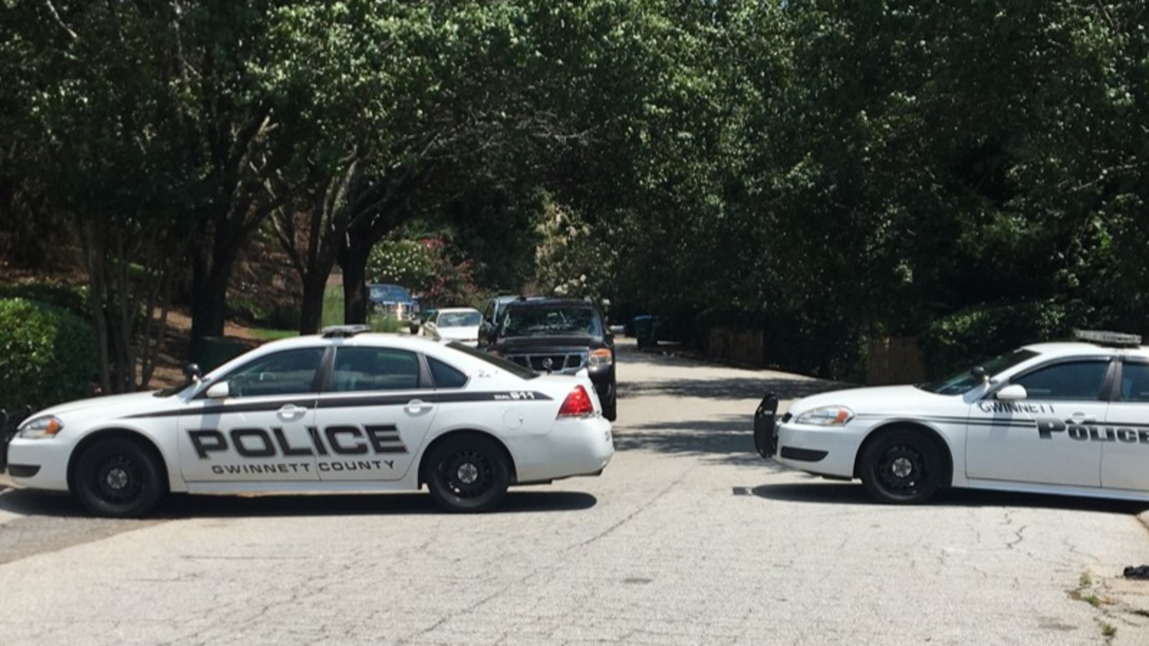 Gwinnett County, Georgia police converge at the scene of a double shooting in metro Atlanta that left two people hospitalized, including a 14-year-old boy. The shooter was still at large Thursday afternoon.