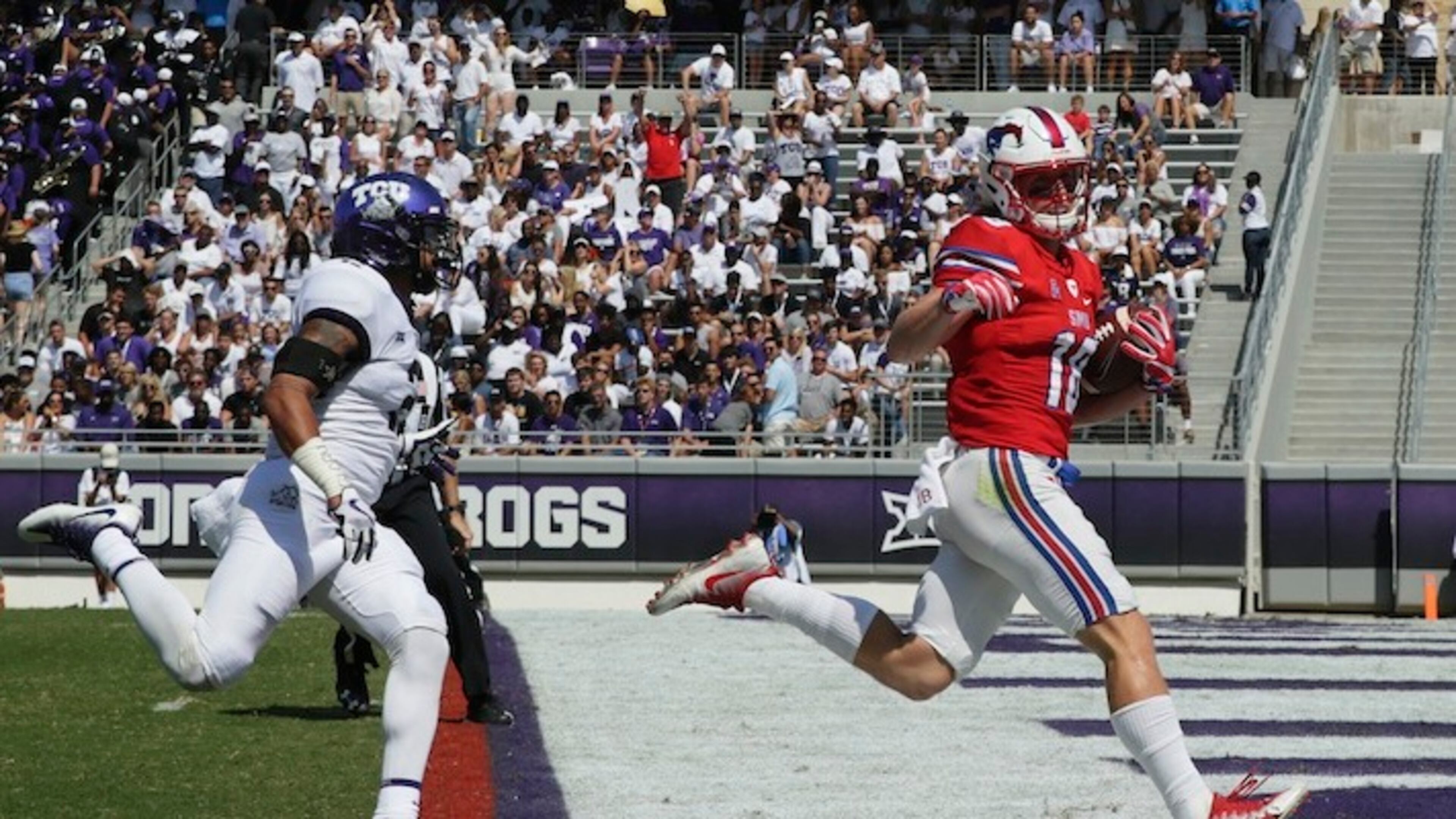 This Sept. 16, 2017 file photo shows SMU wide receiver Trey Quinn (18) beating TCU safety Niko Small (2) to the end zone for a touchdown reception during the first half an NCAA college football game in Fort Worth, Texas. SMU has completed 94 passes over the last three games. Trey Quinn has been on the receiving end of 49. (AP Photo/LM Otero)