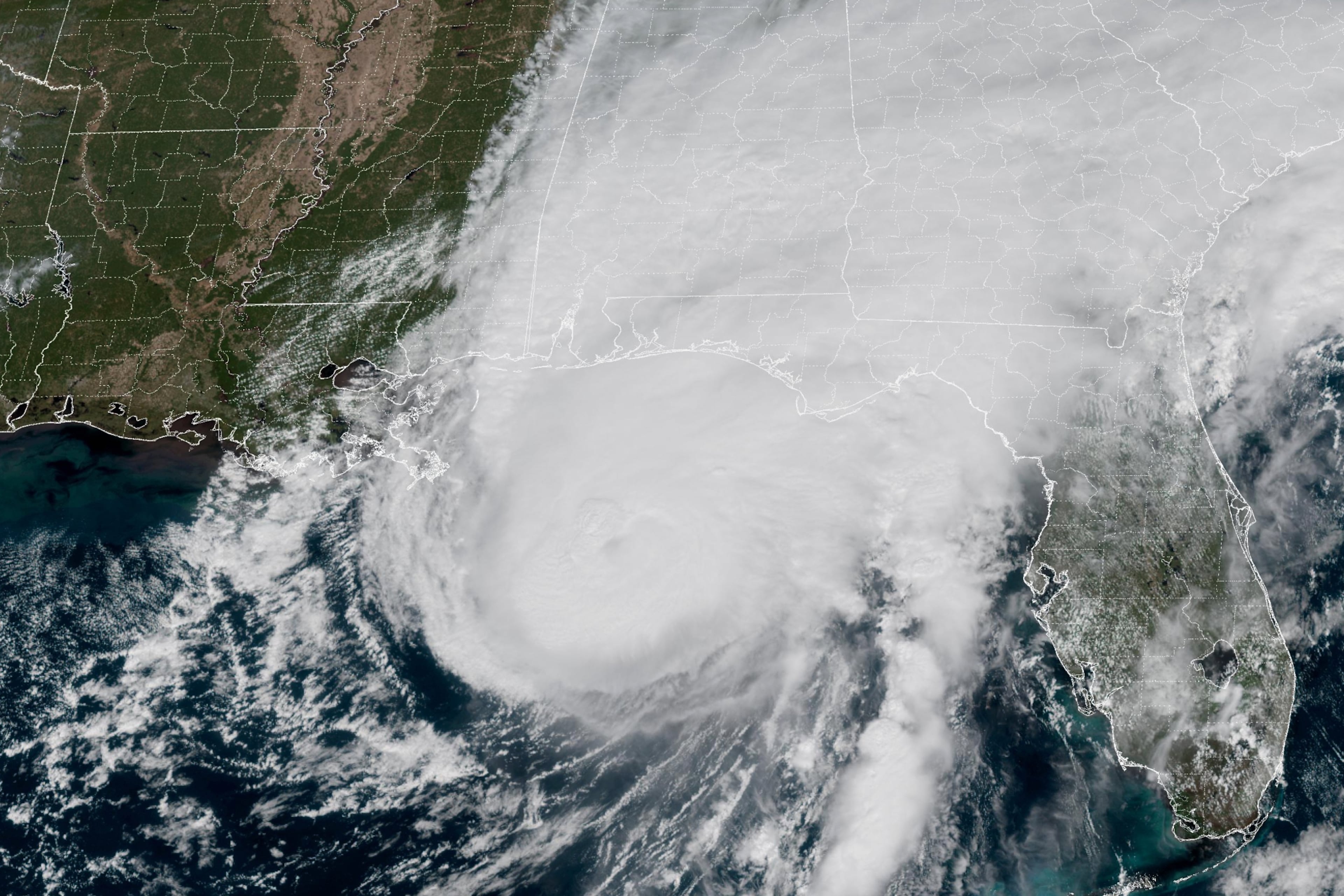 This GOES-19 GeoColor satellite image provided by the National Oceanic and Atmospheric Administration (NOAA) and taken at 1:06 p.m. EDT, Friday, Oct. 9 2026, shows Hurricane Isaias approaching the Gulf Coast of Alabama and Florida. (NOAA via AP)