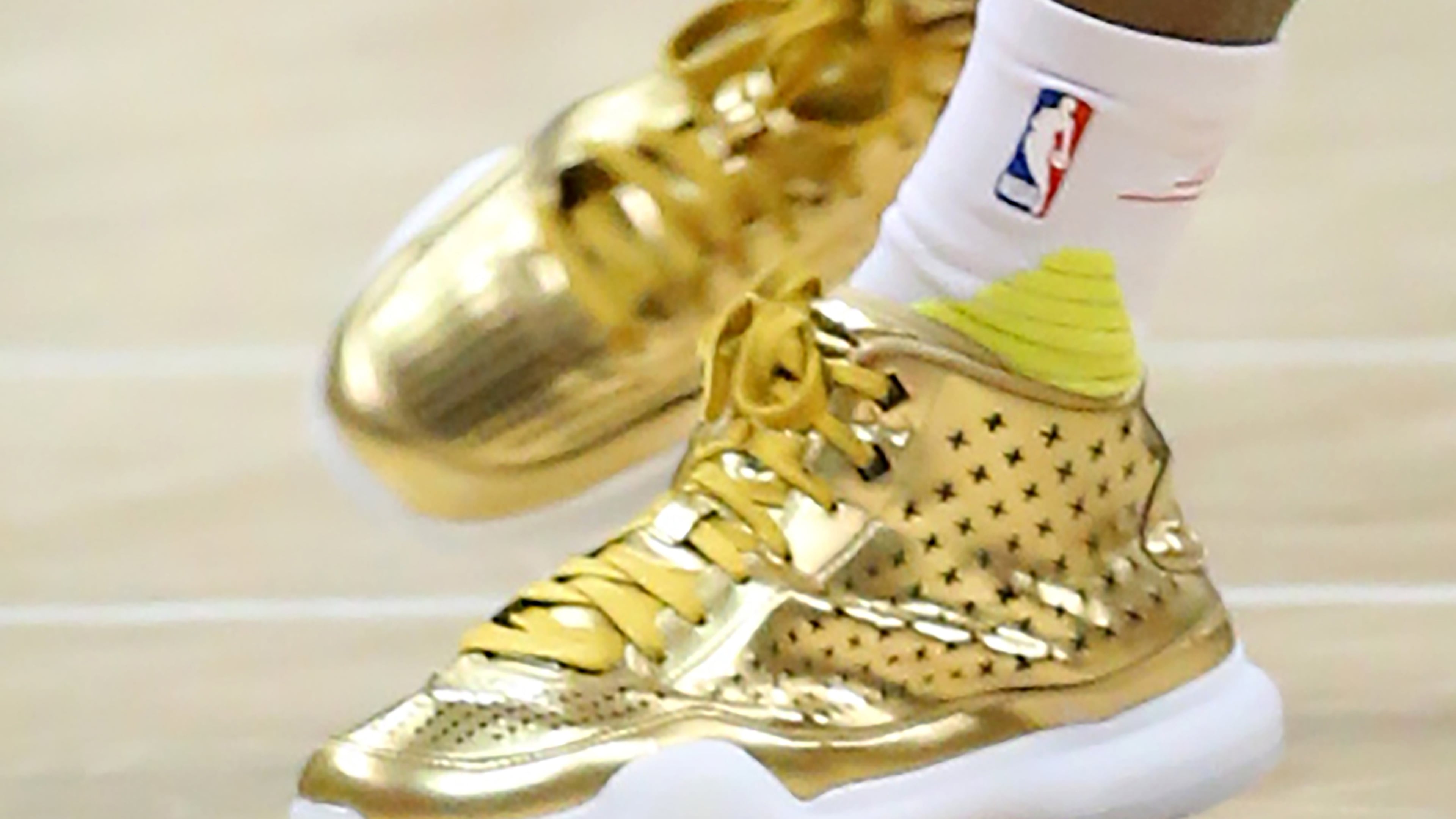 Hawks guard Dennis Schroder wears gold shoes during a game at the 76ers on Wednesday, Dec. 16, 2015, in Atlanta. Curtis Compton / ccompton@ajc.com