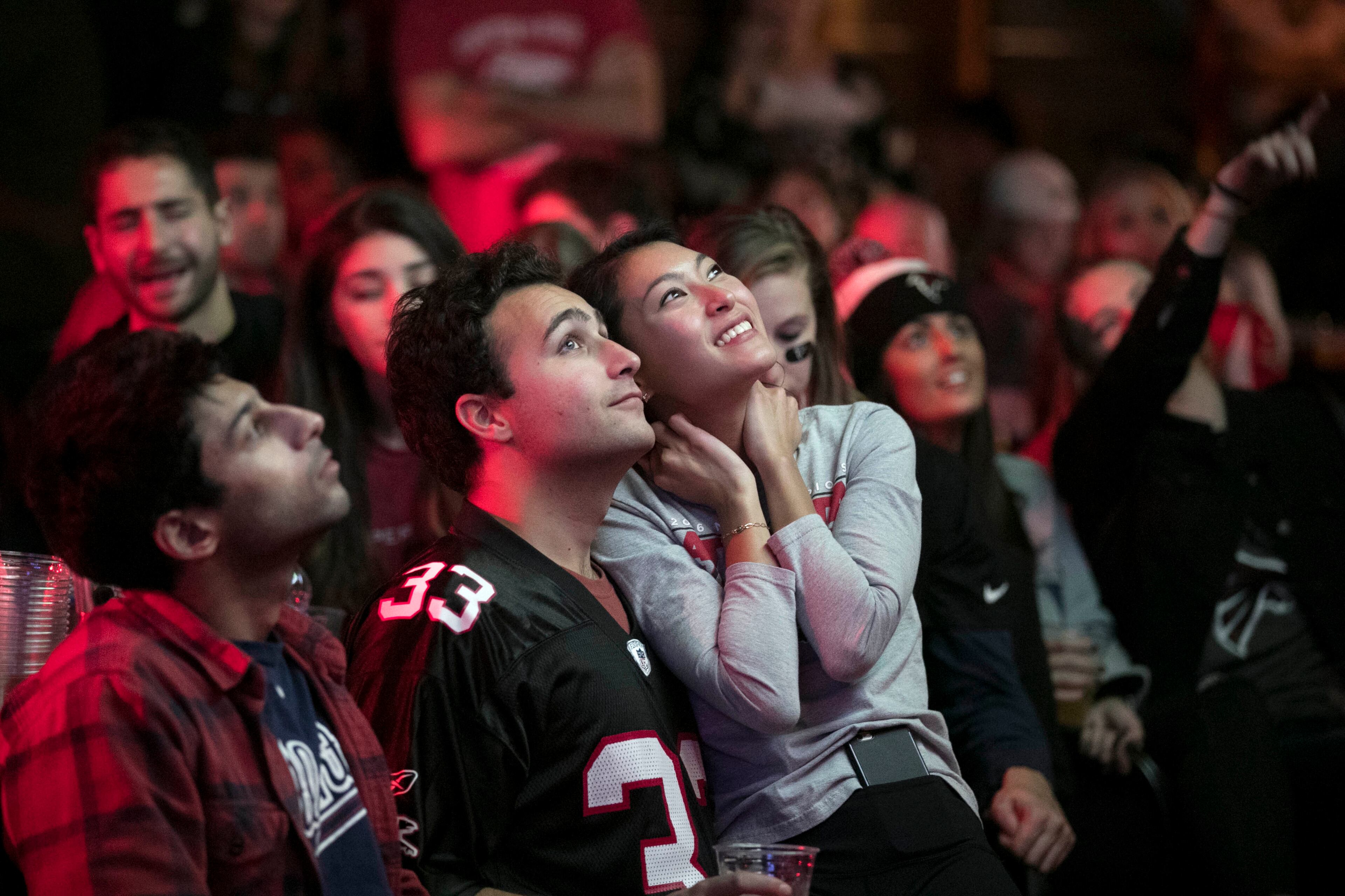 February 5, 2017 - Atlanta, Ga: Atlanta Falcons fan Sarah Lee sit with her boyfriend Nick Taylor as they watch Super Bowl 51 at Park Tavern Sunday February 5, 2017, in Atlanta. The Atlanta Falcons faced the New England Patriots in Super Bowl 51 in Houston. PHOTO / JASON GETZ